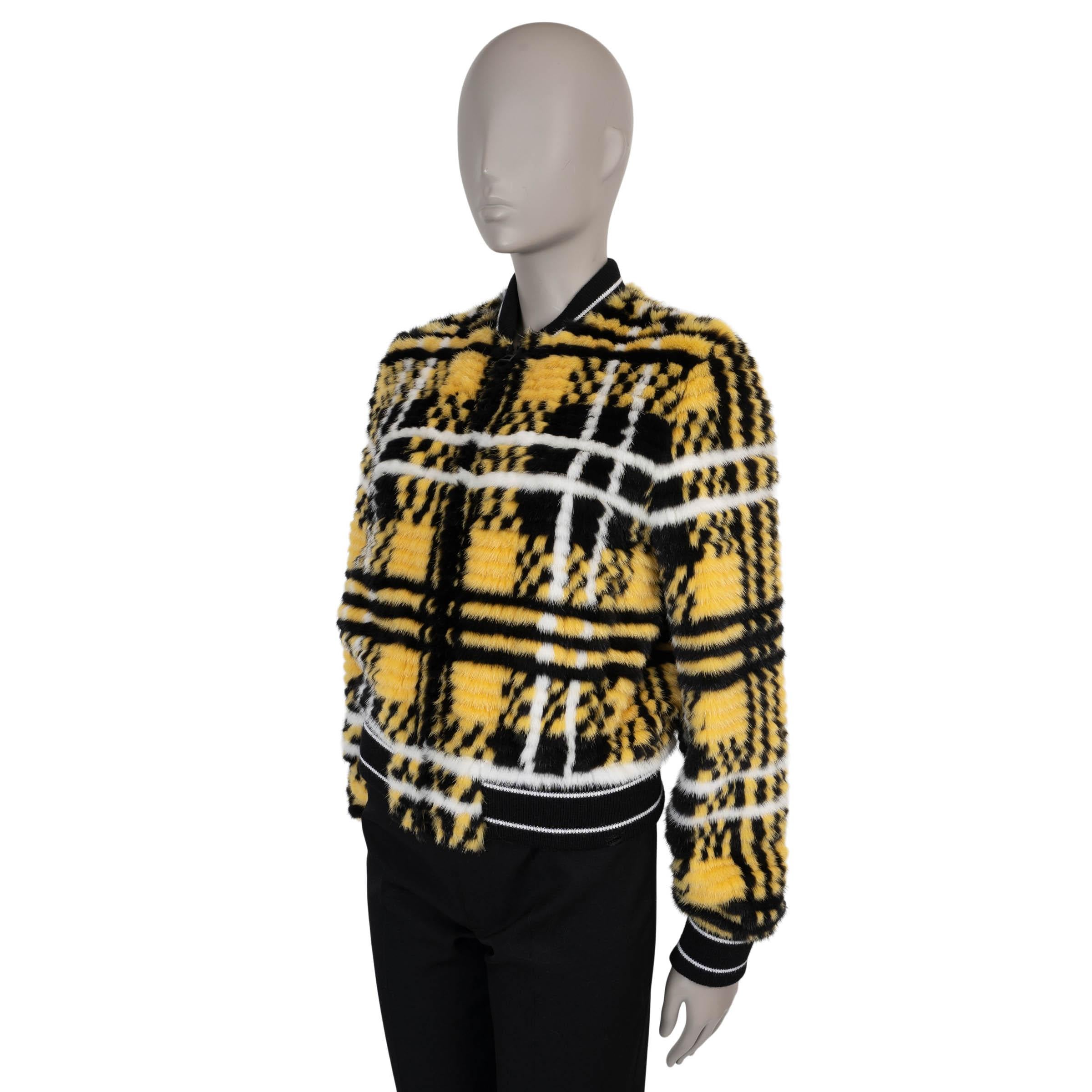 This 100% authentic Christian Dior bomber jacket in yellow, black, and white Check'n'Dior sheared mink redefines luxury outerwear with its bold design and sumptuous texture. Featuring a classic bomber silhouette, it is detailed with black and white