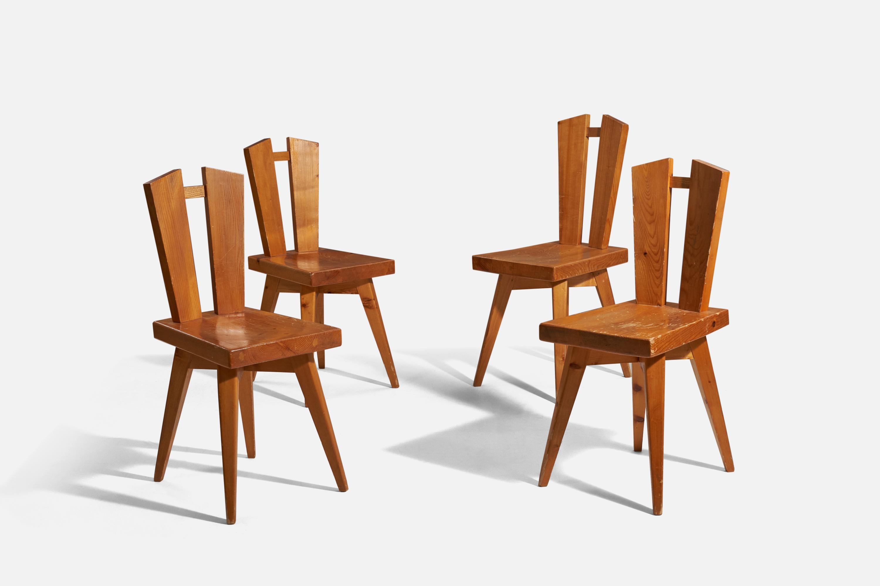 A set of pine dining chairs designed by Christian Durupt, for Charlotte Perriand, France, 1960s.

Please note that one chair is slightly taller than the other three.