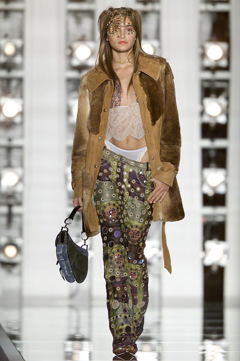 Christian Dior Blue Denim Printed Double Saddle Bag.  Limited Edition blue printed denim pattern saddle bag with CD letter drops from John Galliano’s fall 2001 runway collection.  Fabric lined interior, CD silvertone hinged letters at strap,