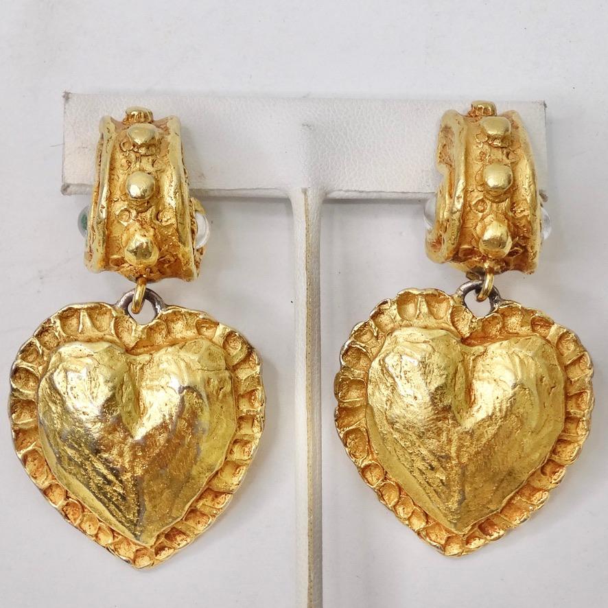 These Christian Lacroix gold plated earrings circa 1980s are going to become your next go-to statement earrings you need in your collection! Incredible yellow gold plated clip on earrings feature an eye catching heart dangling from a gorgeous shell