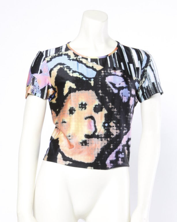 Abstract and colorful pixel print top by Christian Lacroix. Short sleeves and sleek jersey knit fabric.

Label: Bazar de Christian Lacroix
Marked size: Large
Circa: 1990s
