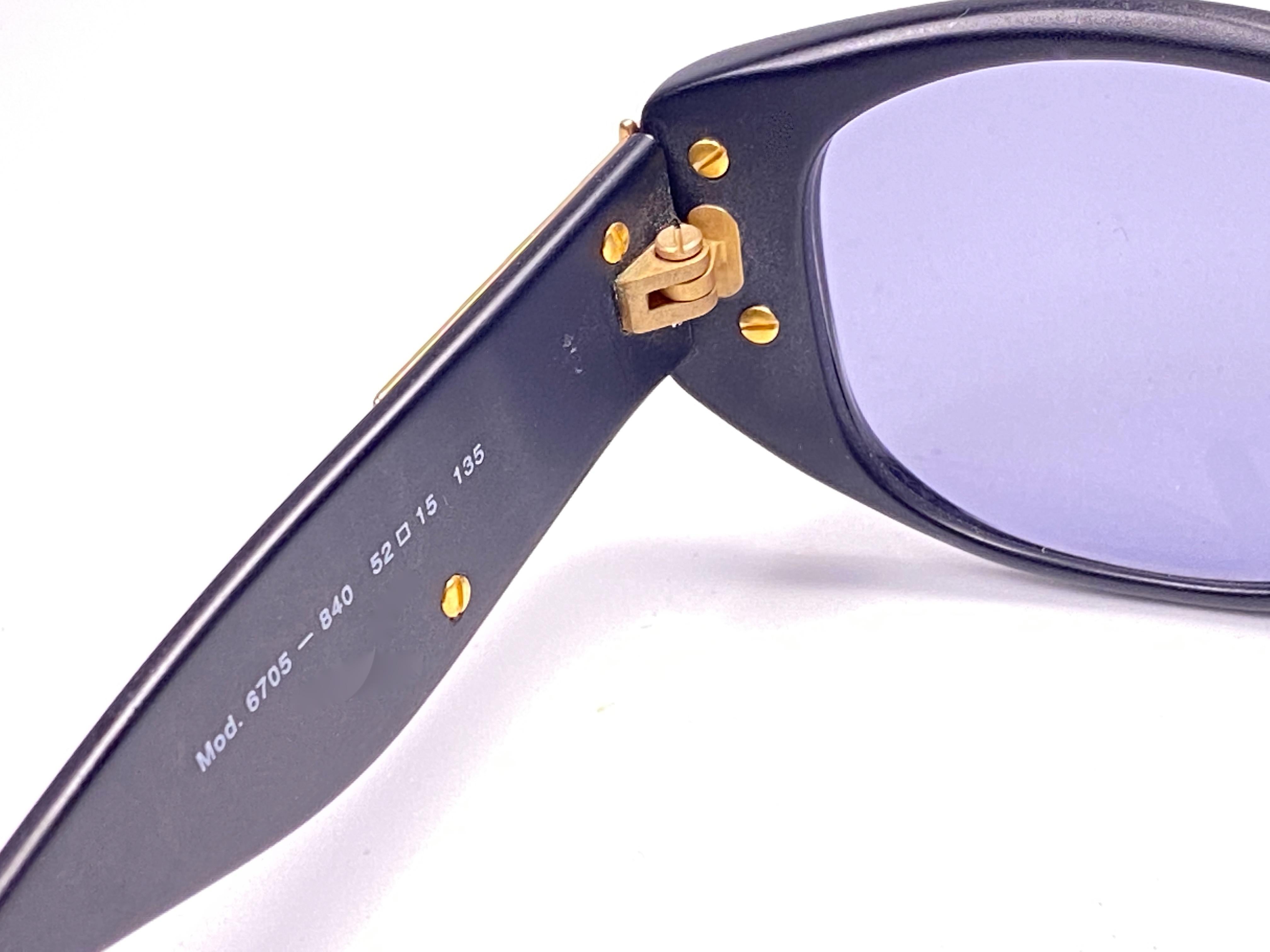 Rare pair of New vintage Christian Lacroix sunglasses.   

Black & gold frame holding a pair of spotless medium grey lenses. 

New, never worn or displayed. 
This item may show minor sign of wear due to storage.
Made in France.
