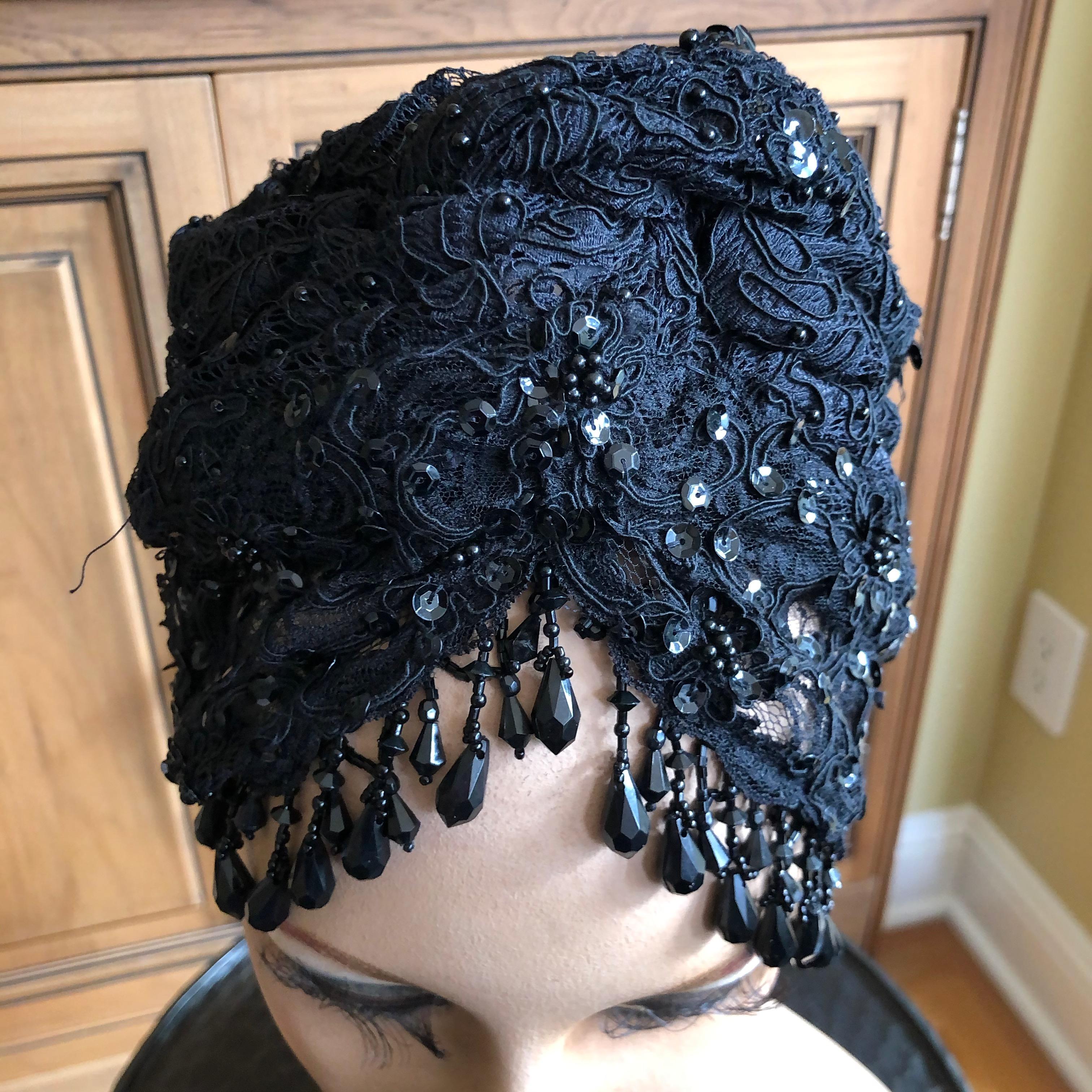 Christian Lacroix Amazing Black Lace Turban with Jet Bead Fringe.
This is part of a three piece Lacroix suit, but the Turban is too unique to tie it to the purchase of the suit.
The suit is also in the store, Lacroix beaded suit.
22.5 inch