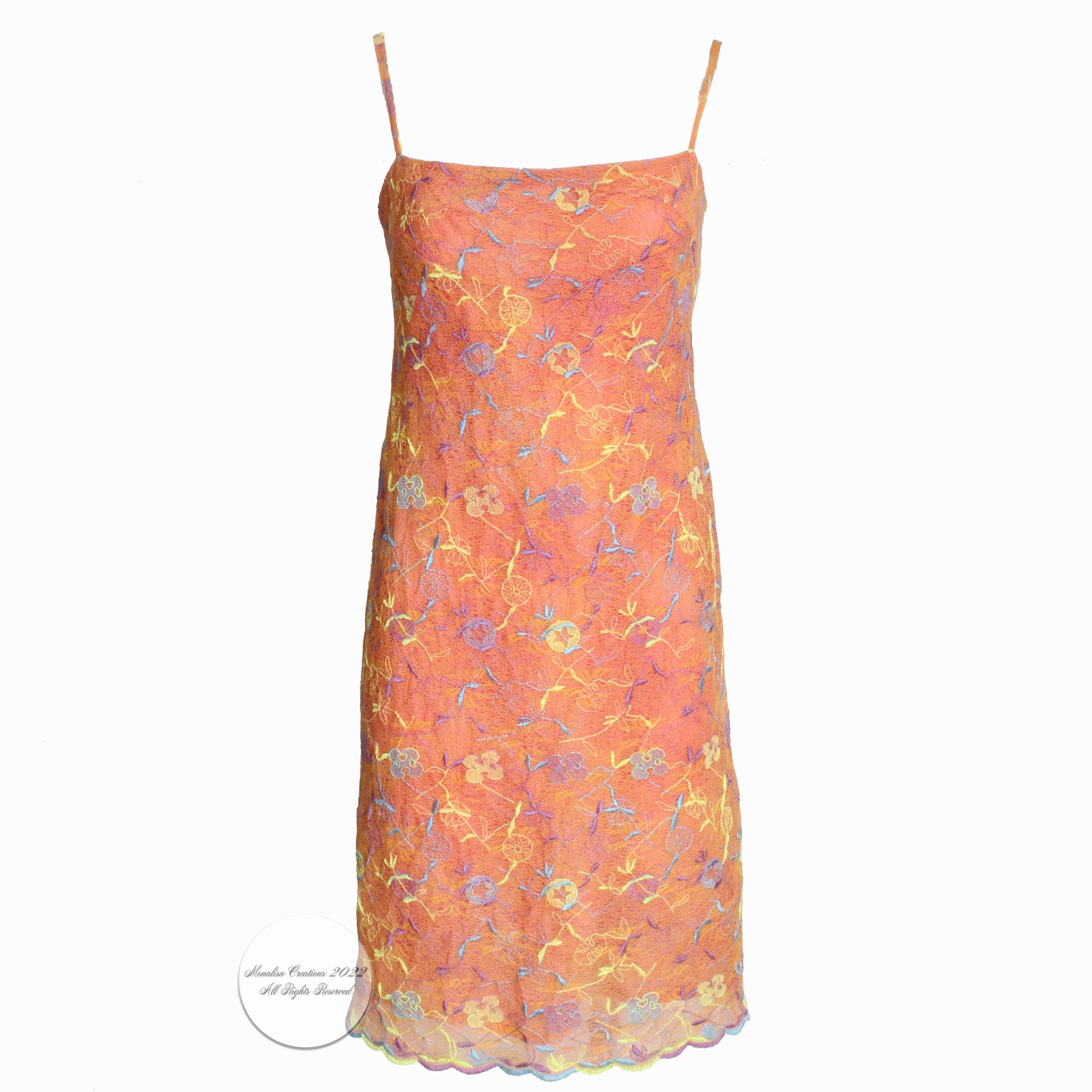 Christian Lacroix Bazar colorful embroidered sundress, likely made in the 90s.  Made from a polyester blend fabric, it's cut sheath style with spaghetti straps and has an embroidered scalloped hem.  Perfect for your holiday jaunts and so easy to