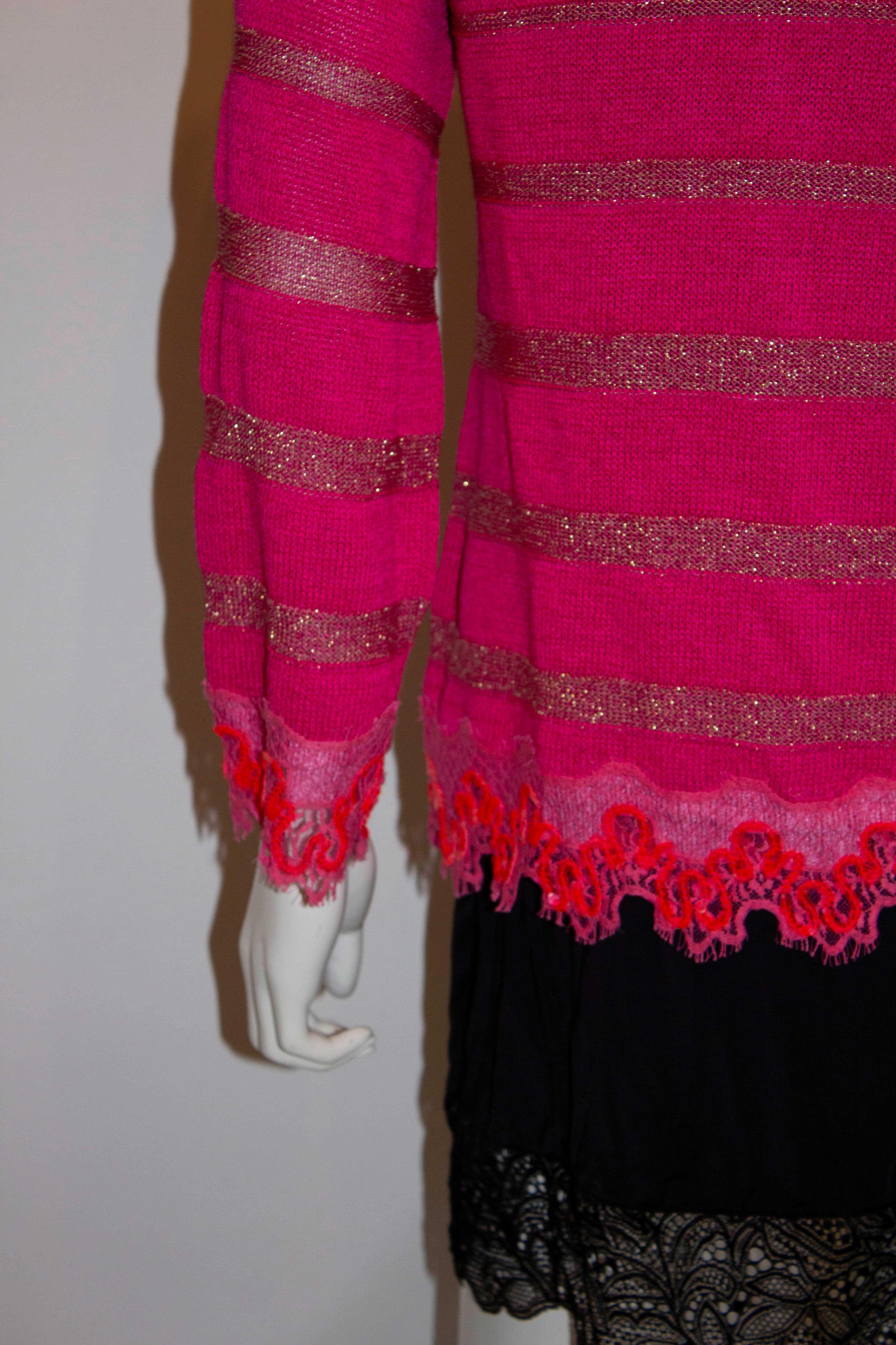 A great twin set to brighten up your Fall outfit. A pretty pink cami and  cardigan by Christian Lacroiz, Bazzar  line. The cami fits a bust up to 38'', length 27'' and has great crochet detail. The cardigan has a round neckline with a seven button