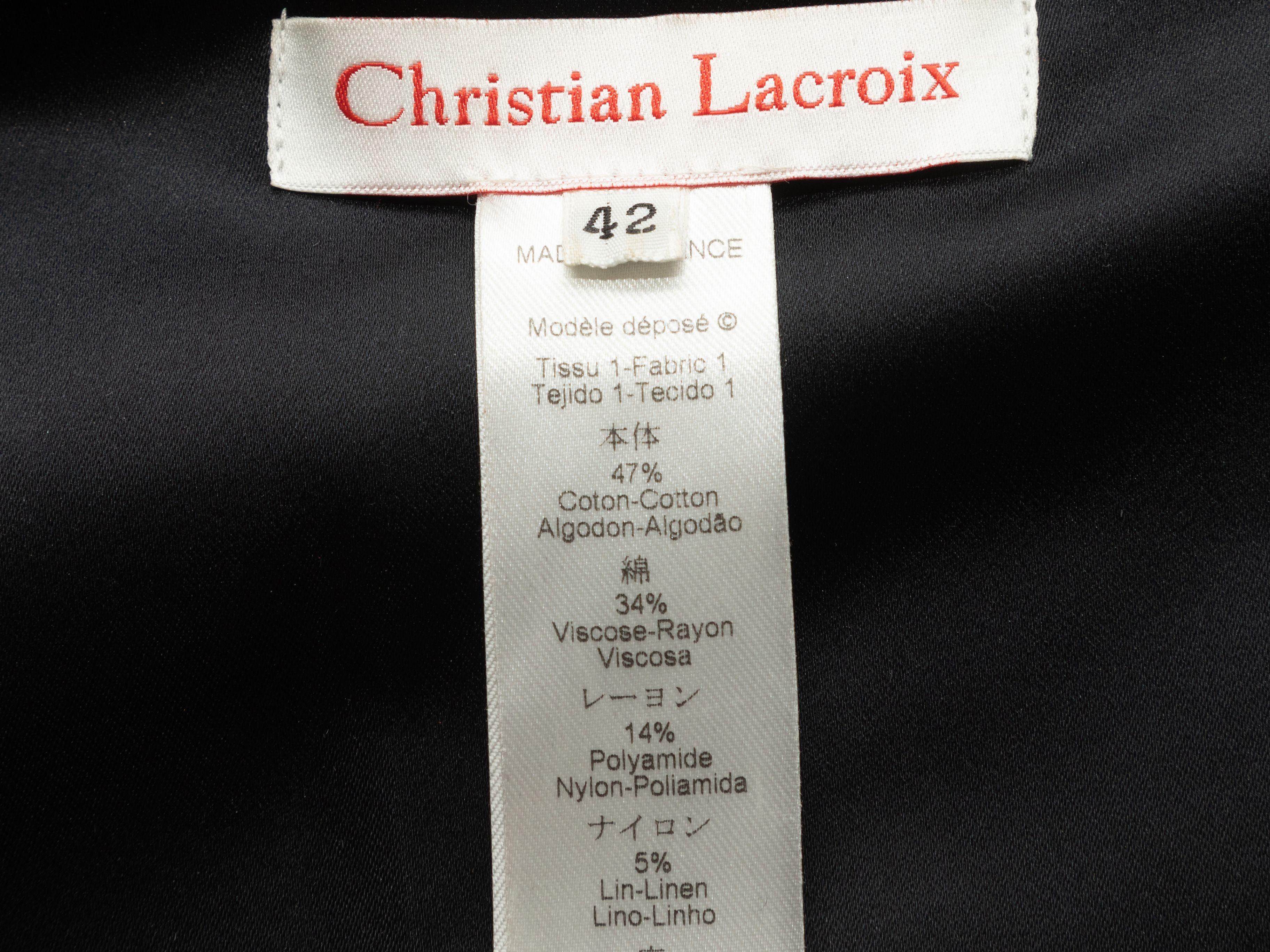 Product Details: Black tweed faux harness blazer by Christian Lacroix. Notched lapel. Single button closure at front. 31