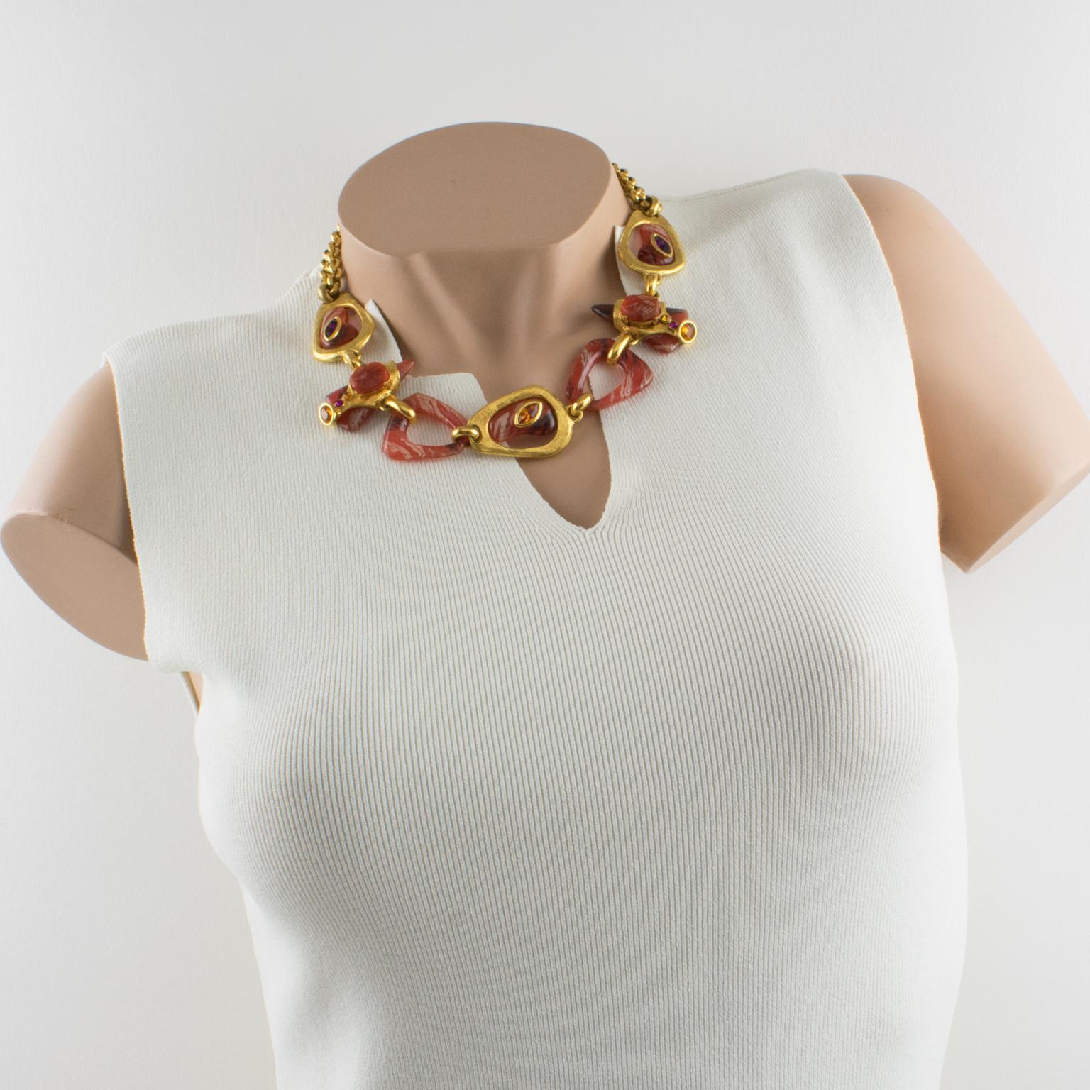 Beautiful Christian Lacroix Paris signed choker jeweled necklace. Double strand heavy gilt metal chain compliments with a large modernist front pendant in brushed gilt metal, ornate with burnt orange resin links and carved cabochons, and topped with