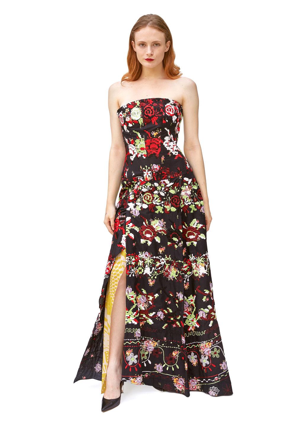 The Christian Lacroix Corseted Embroidered Strapless Gown with Cape is a masterful homage to haute couture’s opulent traditions, blending baroque elegance with the bold, theatrical elements that have defined Lacroix’s design legacy. Known for his