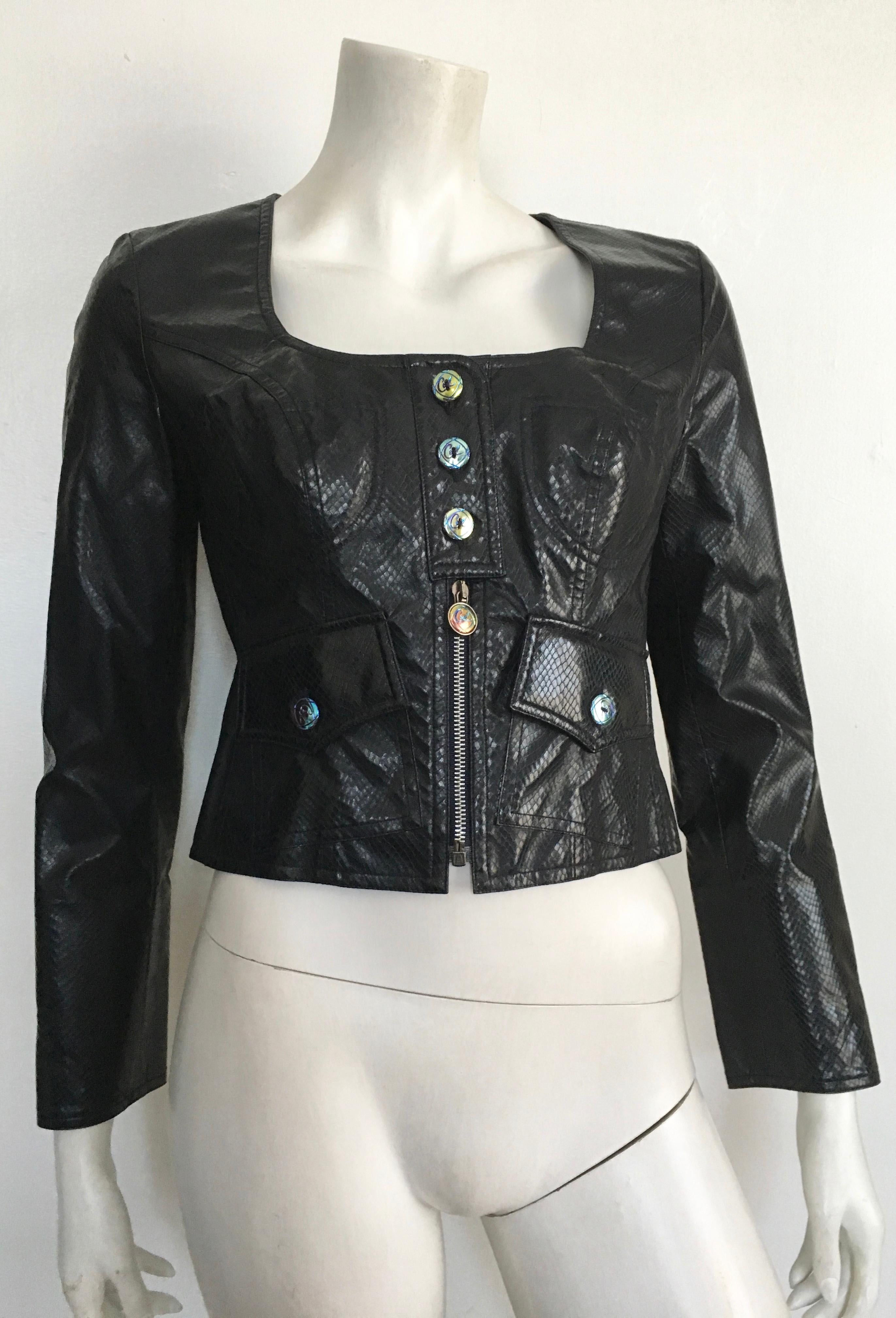 Bazar de Christian Lacroix cropped black faux snakeskin biker jacket is a French size 40 and fits like a size 6. The waist in this jacket is 31. 1/2