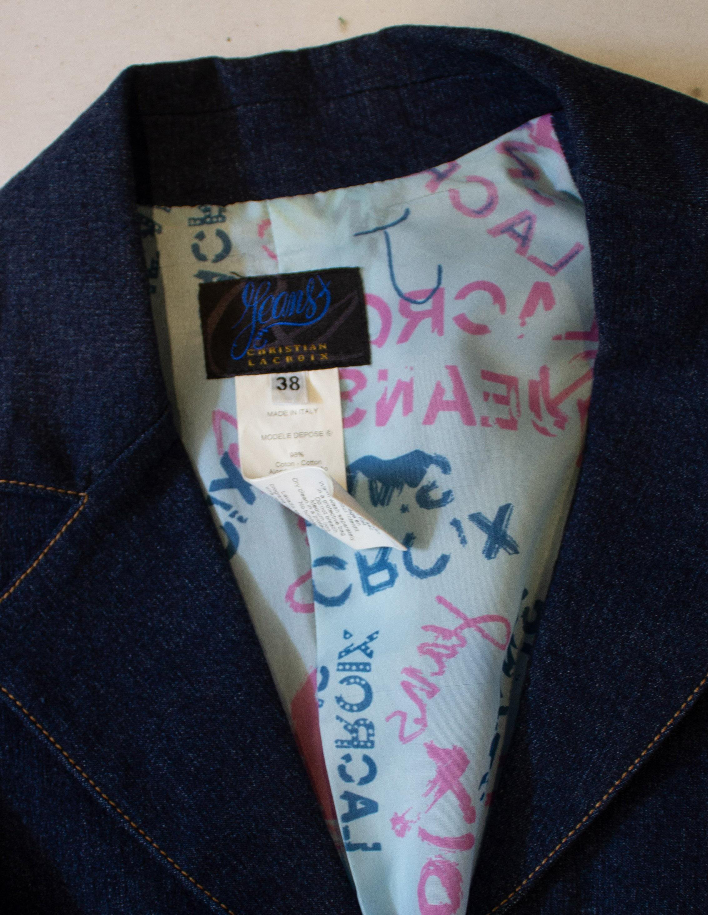 A great jacket for Spring /Summer by Christian Lacroix  Jeans. The jacket has a cut away collar, hidden popper front fastening, and attached belt. It is fully lined