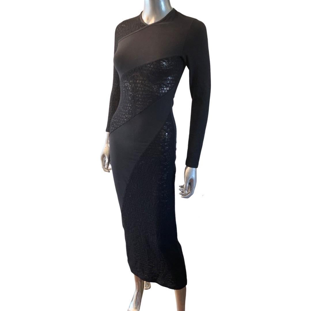A vintage beauty by Christain Lacroix for his Bazar label. The dress fits like a glove. Bias lace knit with solid black knit that higs the body. The lace is slightly see through and placed in the best area you want to see! One sleeve lace, one