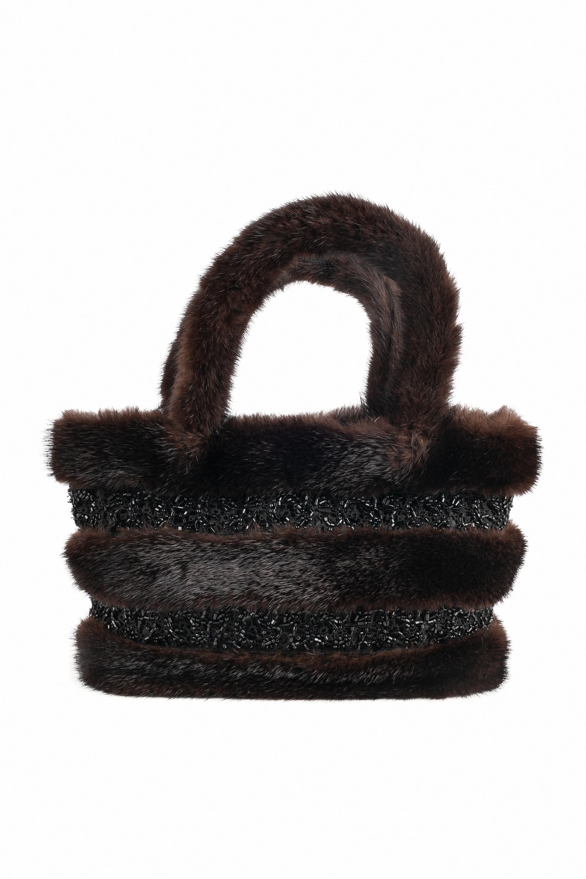 CHRISTIAN LACROIX - (Made in France) Tiny mink and black satin evening bag sewn with black pearls.

Condition:
Very good condition

Dimensions:
Height: 16 cm - Width: 25 cm - Depth: 8 cm - Handles: 32 cm

SKU:S176