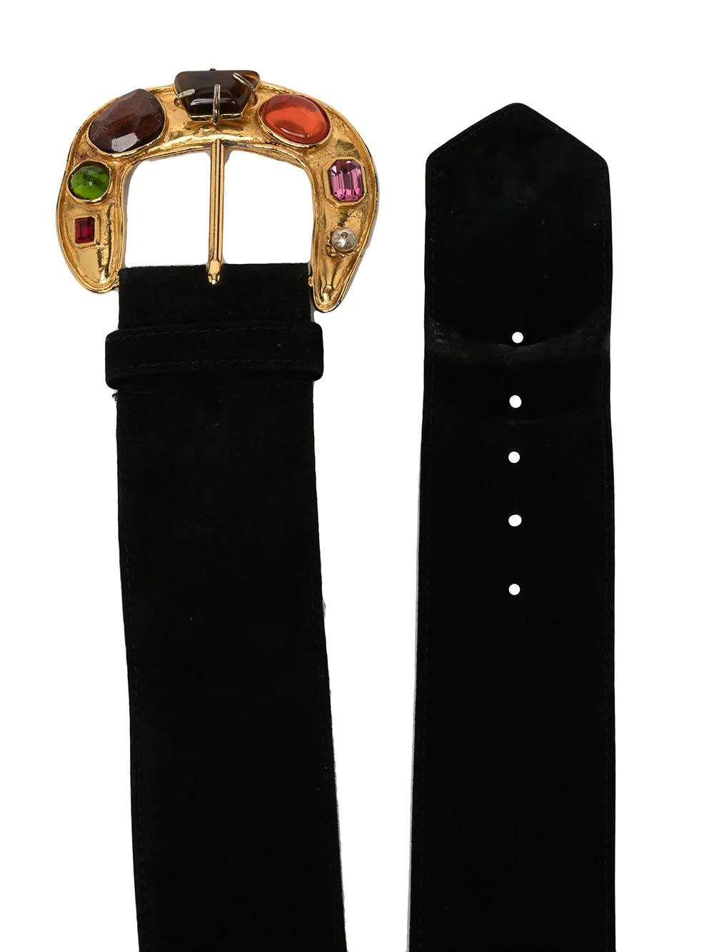 Crafted from black suede, this unique pre-owned Christian Lacroix belt features a resin cabochon and gold-toned hammered metal buckle. Thread it through the belt loops of jeans and mini skirts to add colour to a simple outfit. 

Colour: