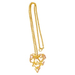 Christian Lacroix, collier pendentif cœur brutaliste en métal doré et bijoux roses
