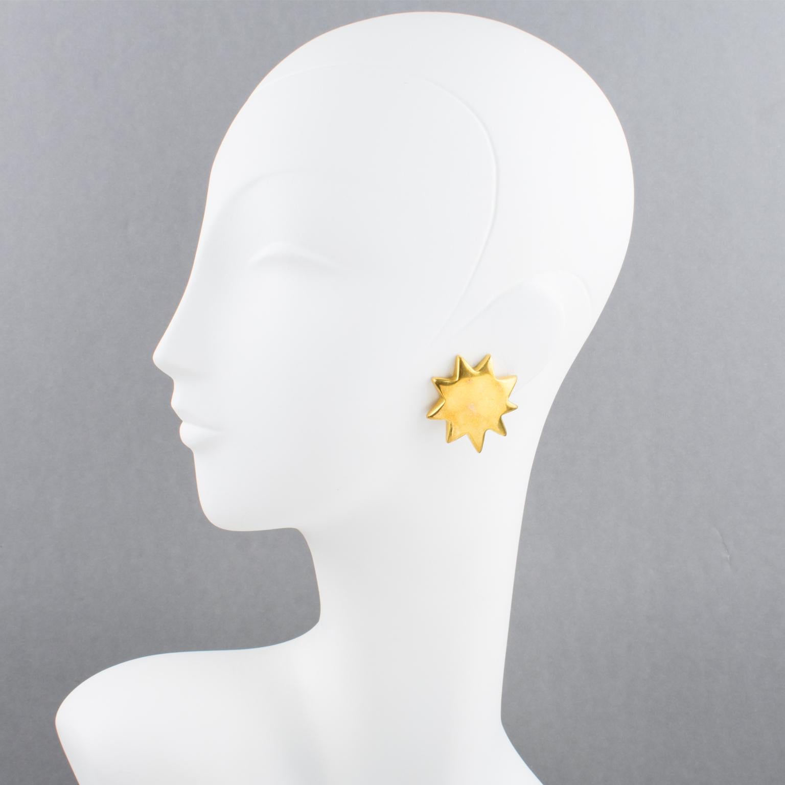 Charming Christian Lacroix Paris signed clip-on earrings. Featuring dimensional gilt metal sun shape. Marked underside: 