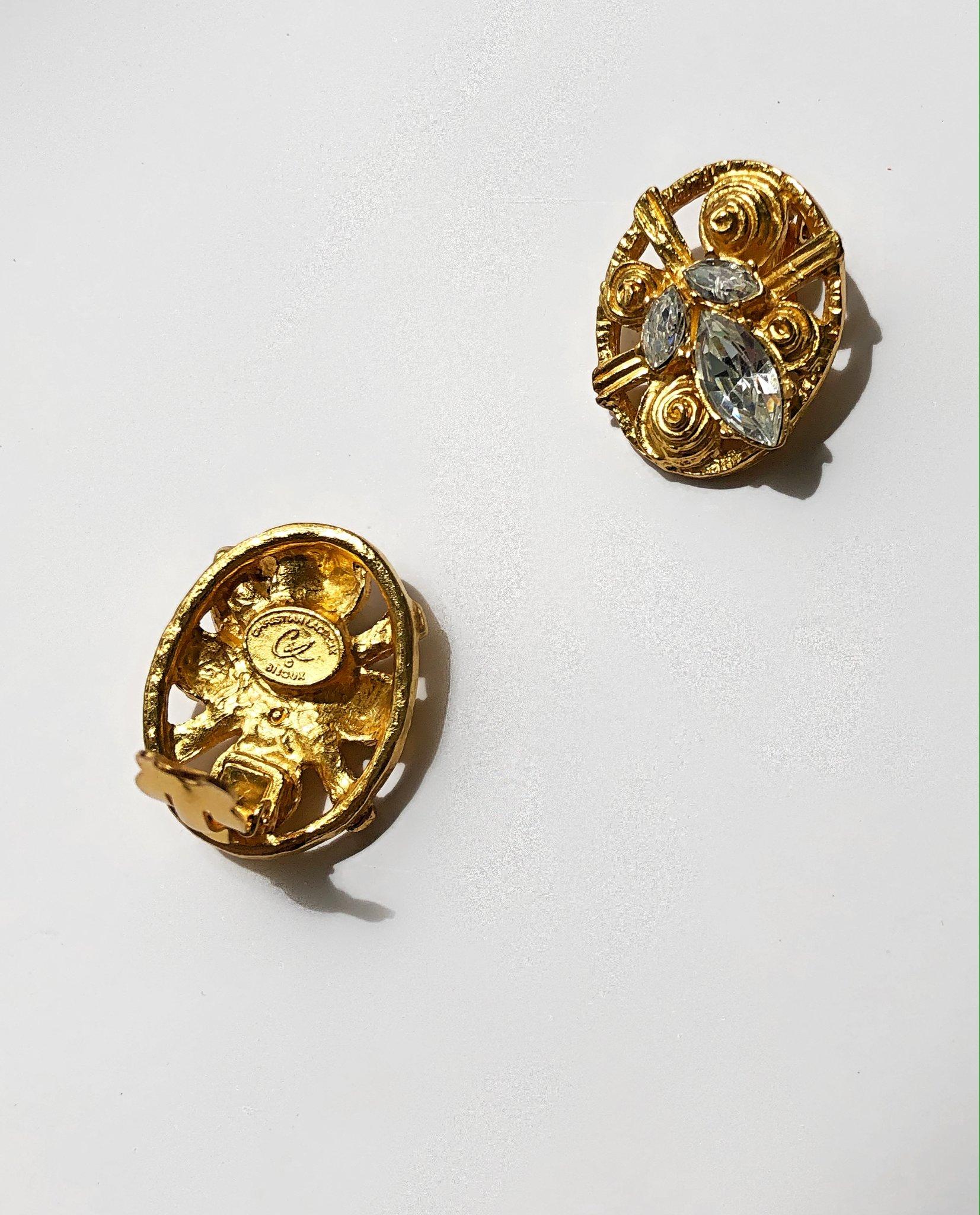 This stunning pair of vintage clip-ons by Christian Lacroix will add the perfect amount of sparkle to your outfits. Encrusted with crystals and coated in gold plate, this rare pair was created by the artisan couturier during his tenure at the