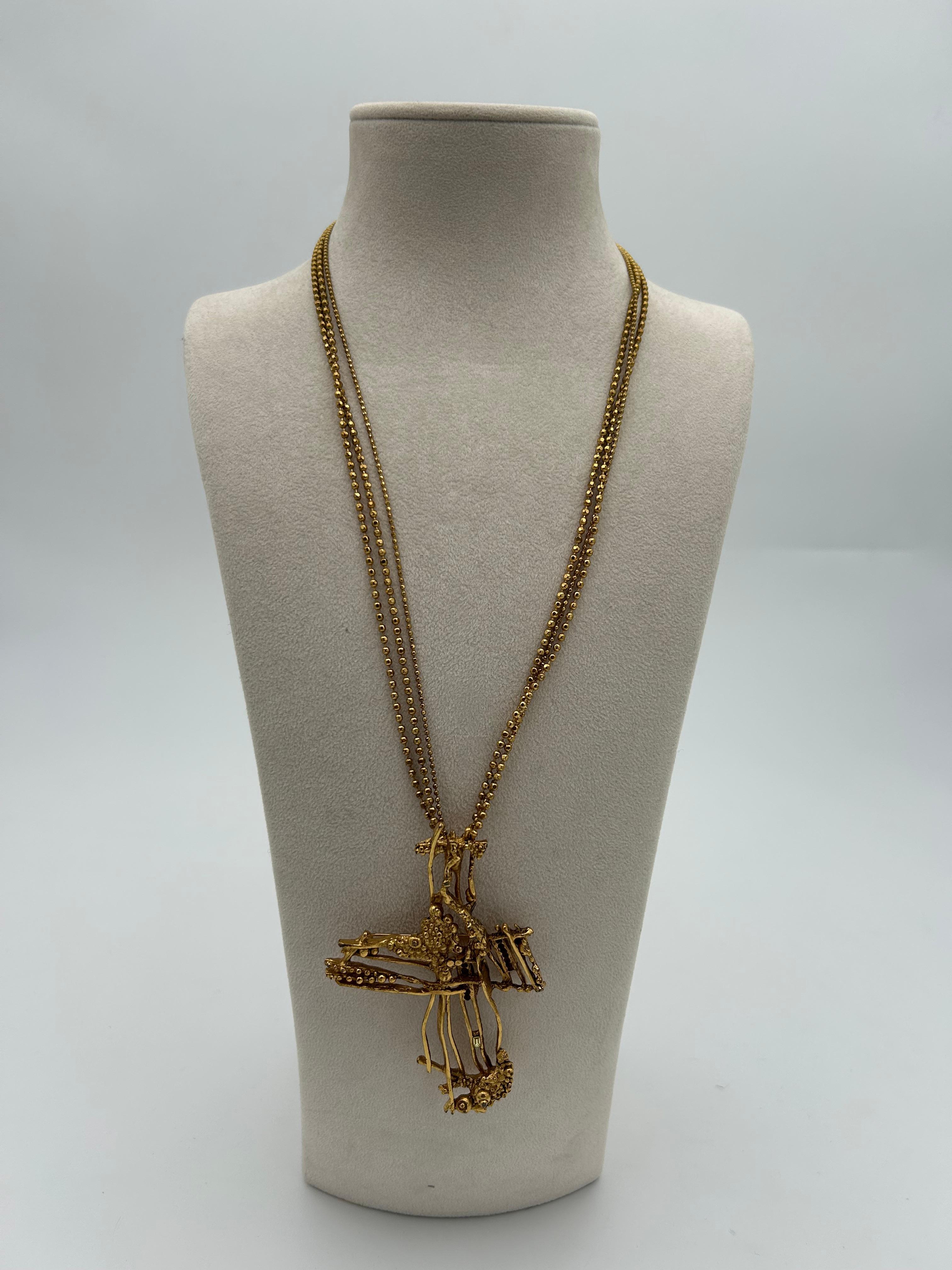 Christian Lacroix Gold Toned Brooch / Necklace. Beautiful and practical item to add to your collection. This piece perfectly represents the creativity and uniqueness of Christian Lacroix jewelry, making this a sought after piece among collector and
