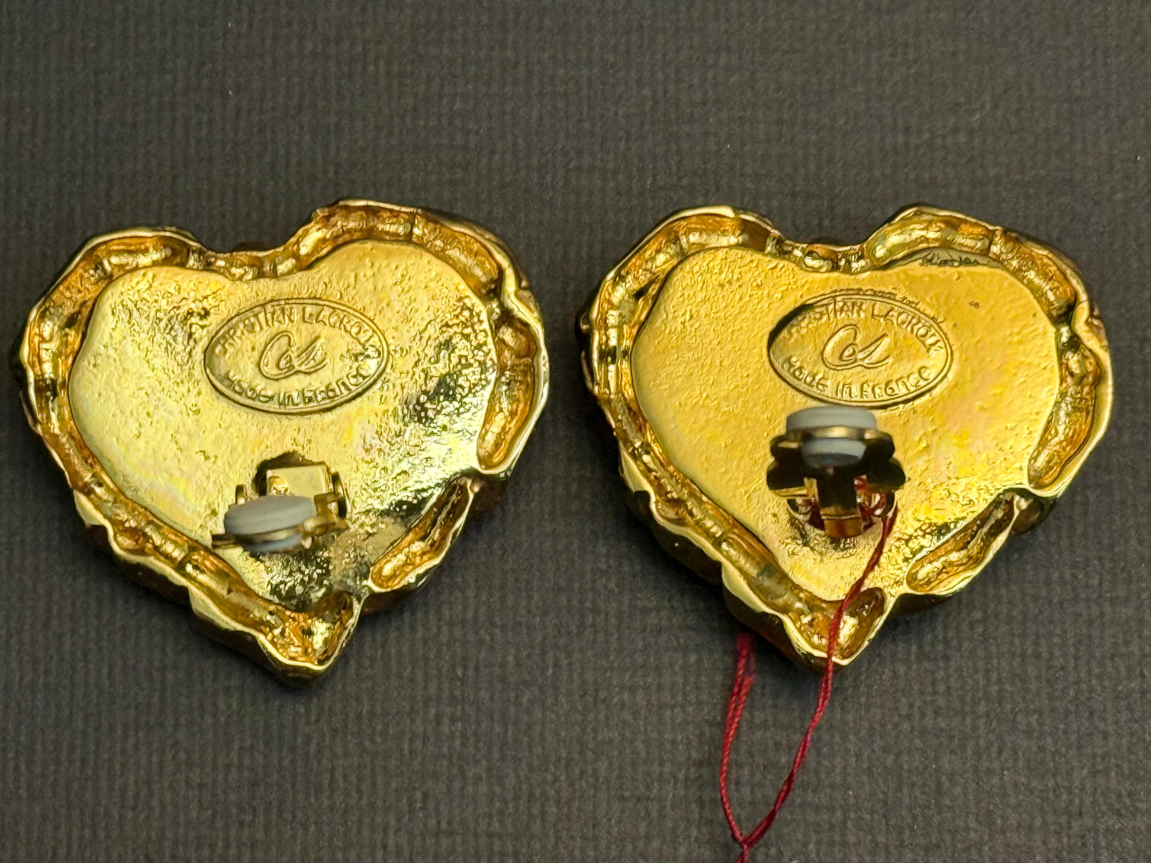 - Vintage Christian Lacroix gold toned hardware clip on earrings. 

- Green glass. 

- Attached with original brand tag.

