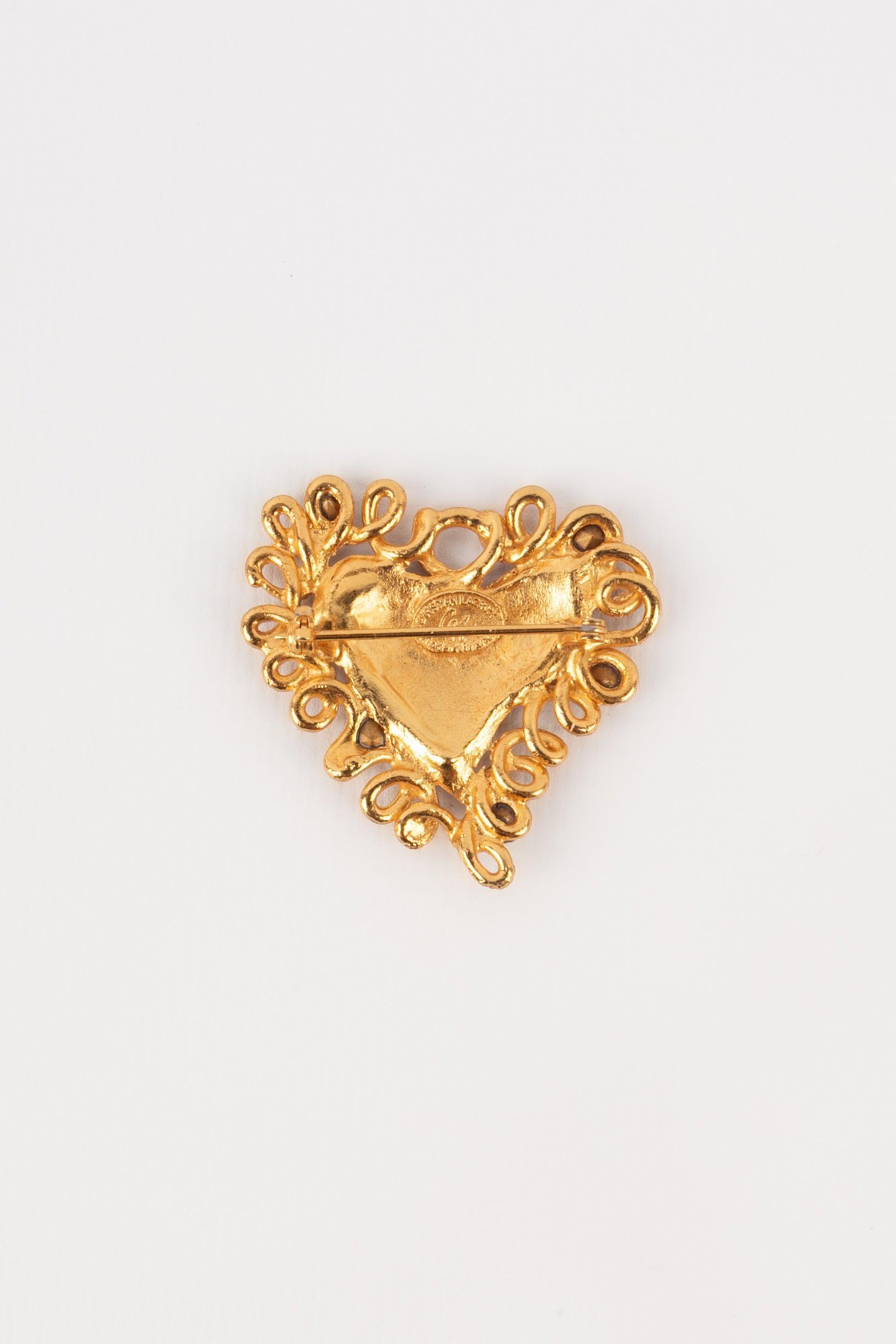 Christian Lacroix - (Made in France) Golden metal heart brooch with rhinestones.

Additional information:
Condition: Very good condition
Dimensions: Height: 4.5 cm

Seller Reference: BR72
