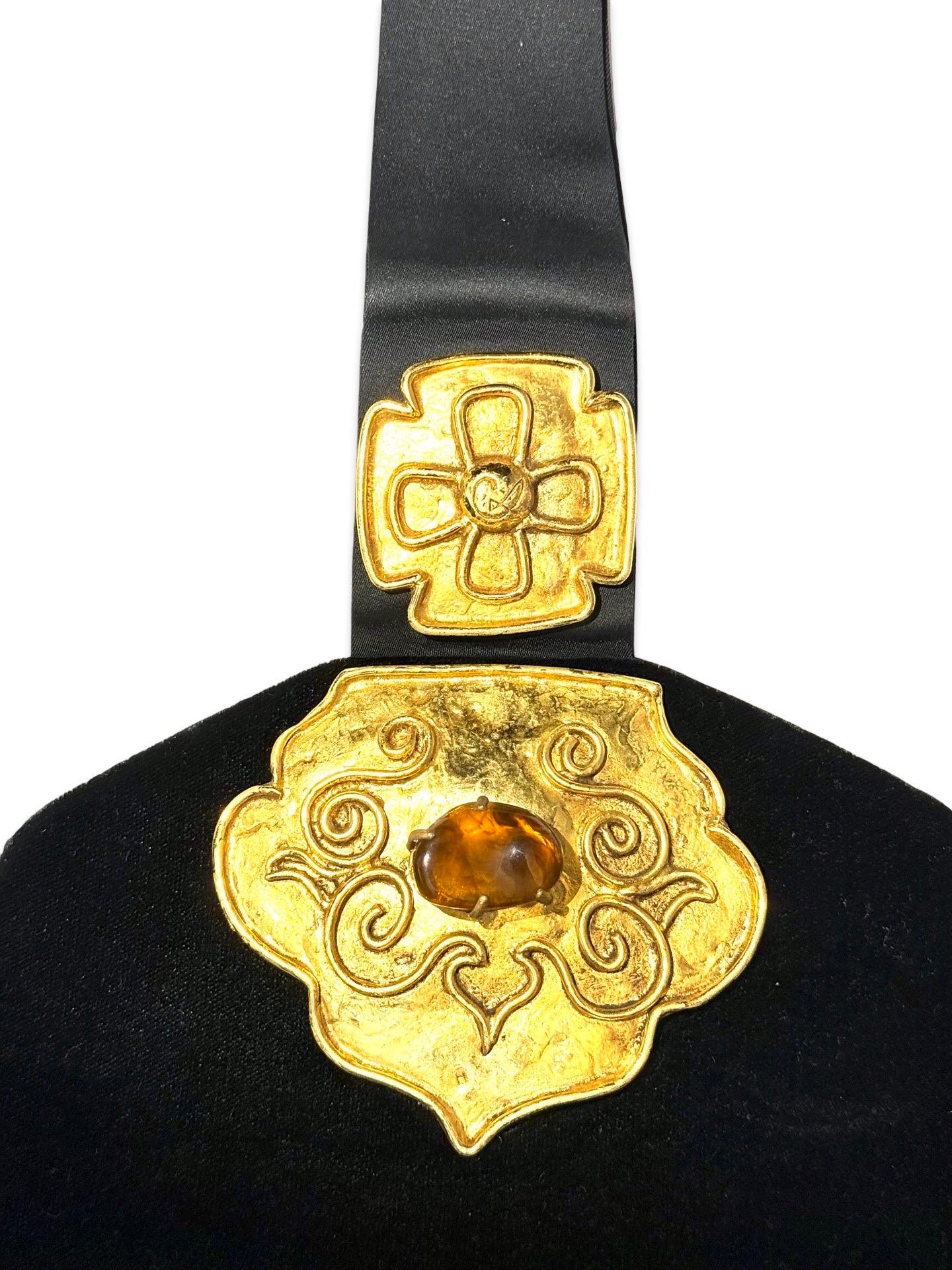 - Vintage 90s Christian Lacroix black velvet and satin handle bag. 

- Hexagon shape. 

- Featuring signature Christian Lacroix gold toned hardware prints. 

- Satin based. 

- Satin interior.

- One interior slip pocket. 

- Snap button closure.
