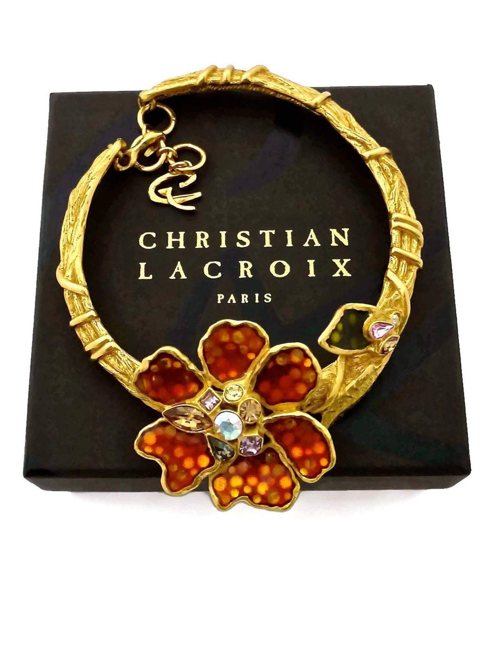 Vintage CHRISTIAN LACROIX Iridescent Flower Rhinestone Enamel Rigid Choker Necklace

Measurements:
Height: 2.28 inches (5.8 cm)
Width: 15.35 inches (39 cm)

Features:
- 100% Authentic CHRISTIAN LACROIX.
- Massive iridescent flowers and leaf with