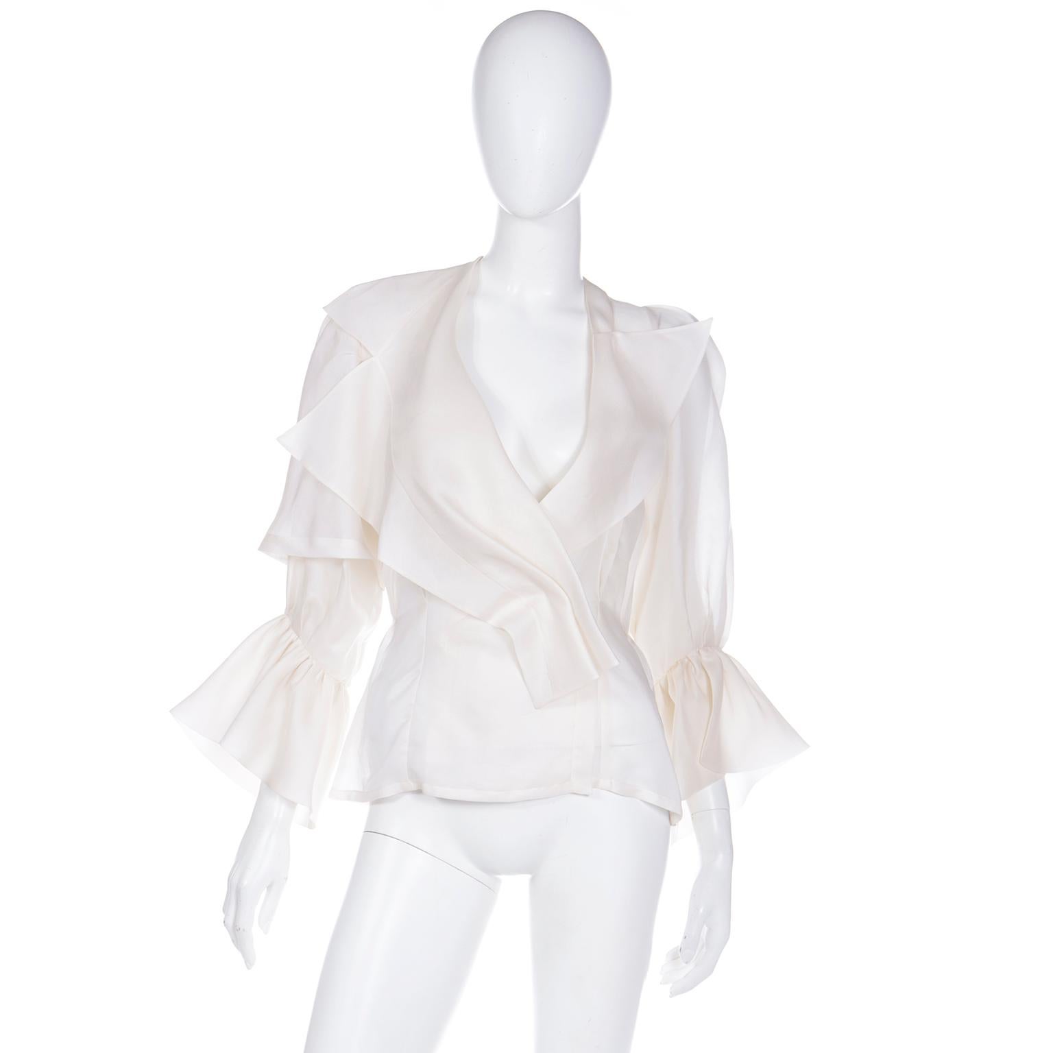 This vintage Christian Lacroix F/W 1995 deadstock ivory silk organza blouse is one of the prettiest tops we've ever seen! Reminiscent of the gorgeous blouses that Gianfranco Ferre designed for Dior, this blouse is in a luxurious silk organza and the