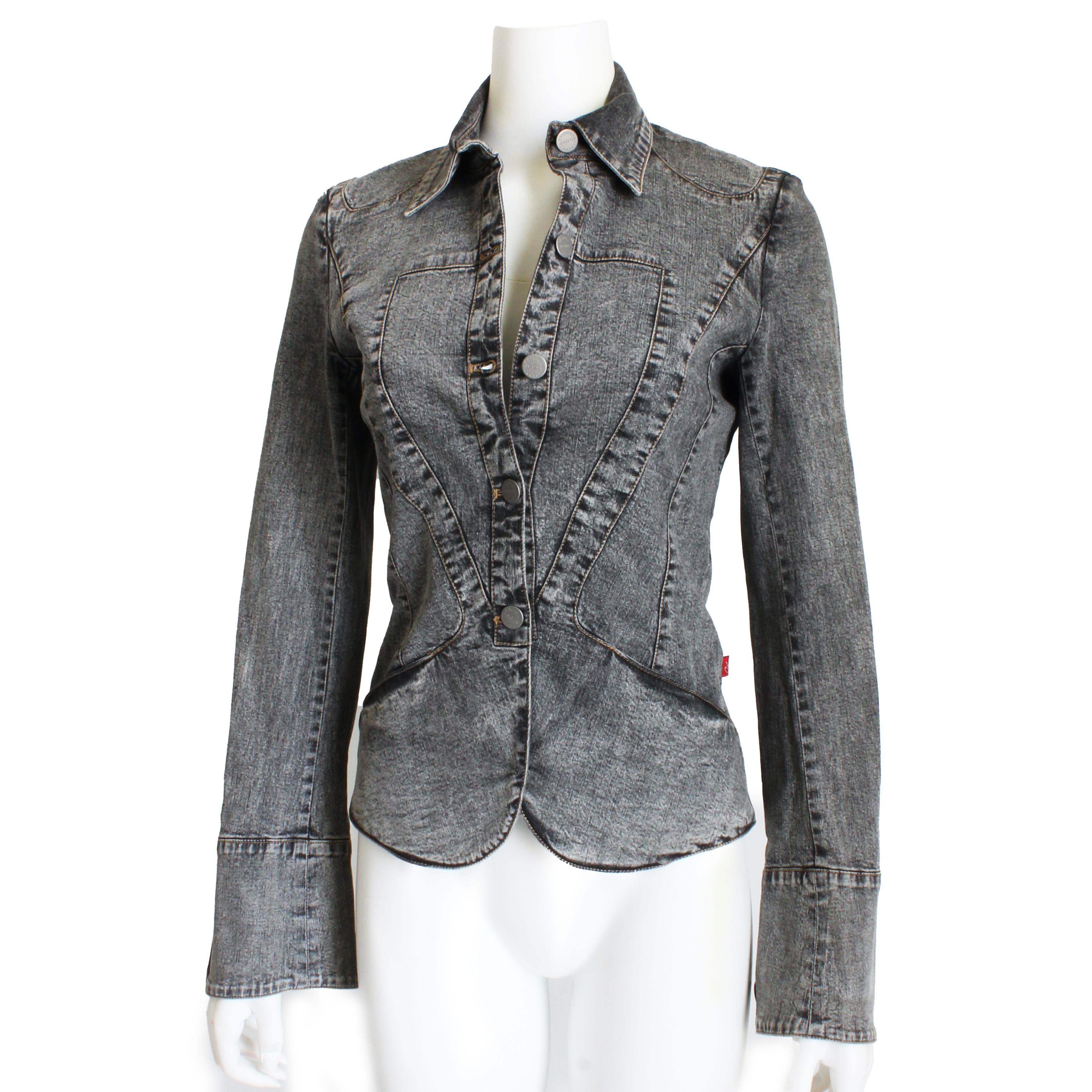 Preowned Christian Lacroix denim jacket, likely made in the early 2000s.  Made from a distressed black cotton denim, this chic little jacket features bell cuffs, a cropped cut and a wonderful embellished heart, trimmed in denim fringe, on the