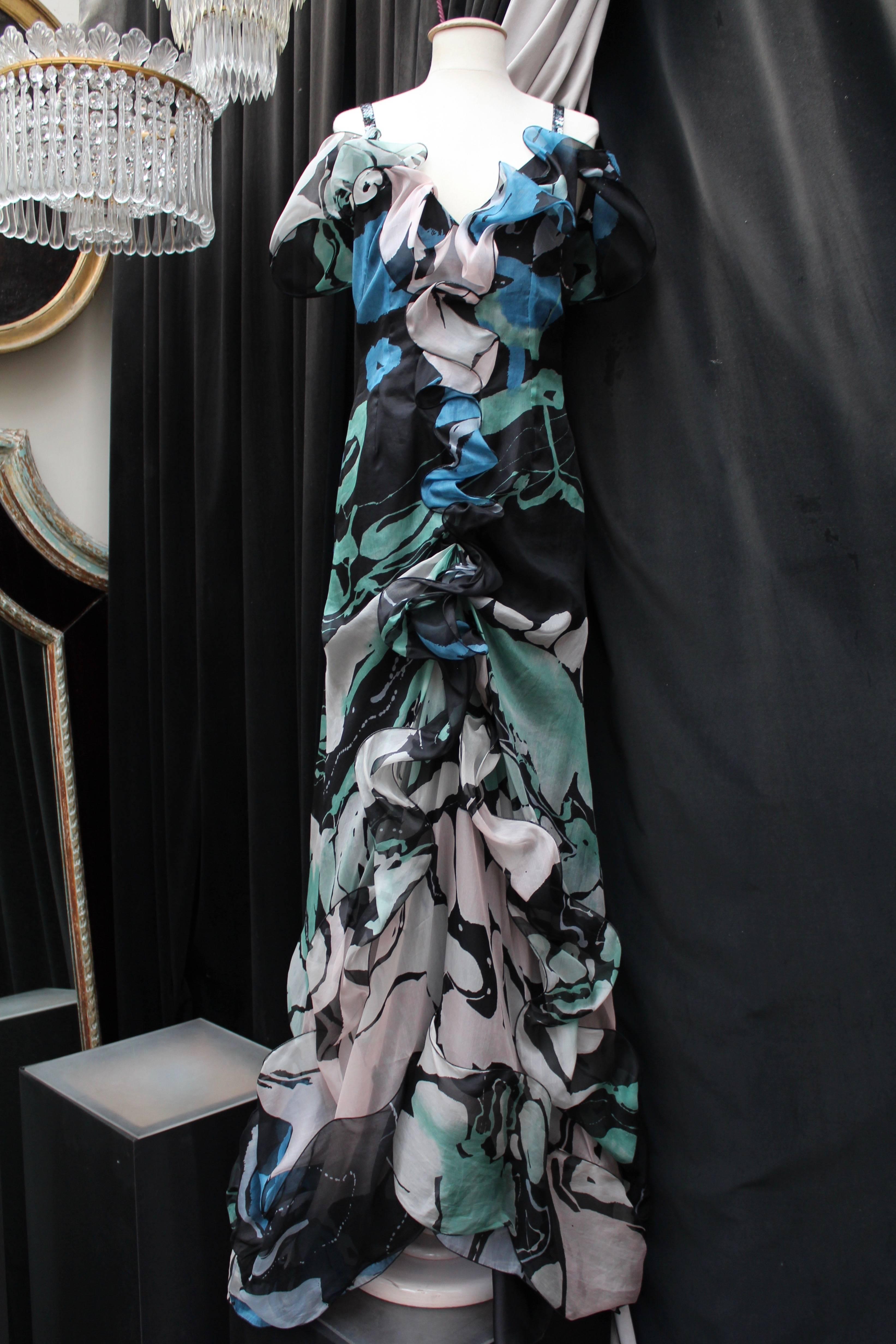 CHRISTIAN LACROIX (Made in France)  Long organza evening dress with tight-fitting cut in mermaid style, with a deep bare back . The fabric is printed with round geometric and abstract shapes in black, blue, pink and green colors. The dress is