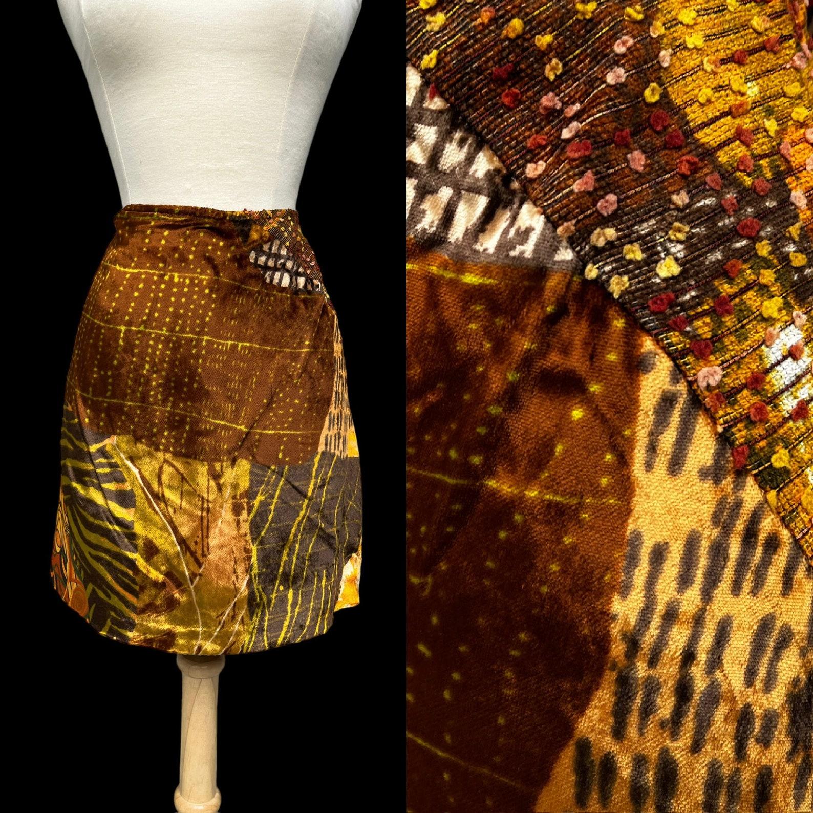 Vintage Christian Lacroix mixed media bias cut mini skirt. three panel mixed print, pattern and texture. front is velvet, side & back are a nubby knit with raised pom pom effect + smooth woven fabric. zip closure. skirt is lined. dry cleaned.

Circa