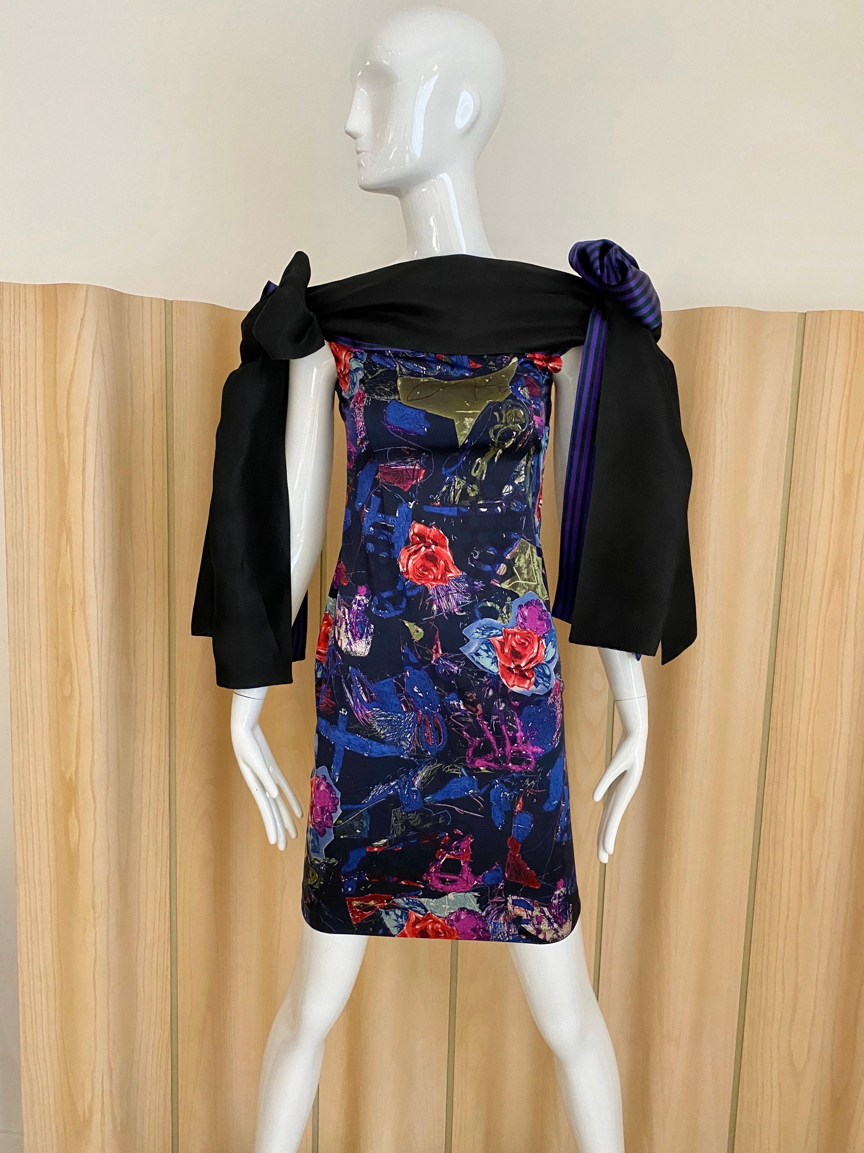 90s Christian Lacroix Purple, blue ,black , purple and red floral print with two oversized bows on the shoulder. Form fitting dress.
size: 0/2/ XS
