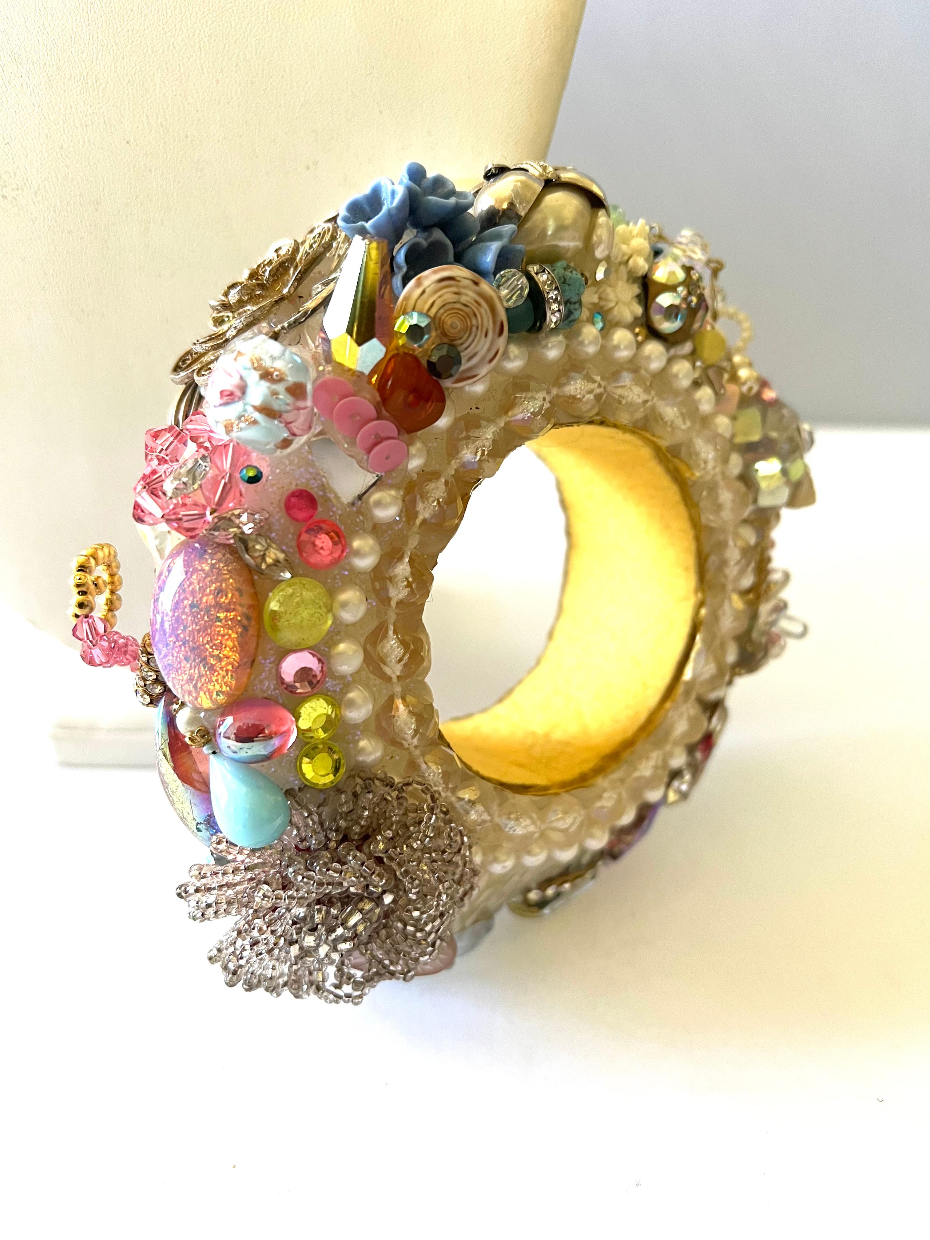 Scarce and highly collectible Christian Lacroix ornate bangle bracelet, adorned by ab crystals, faux pearls, pink glass stones, and silver-tone metal findings. Christian Lacroix defile Pret-a-Porter Spring 1995. Please see the last image for