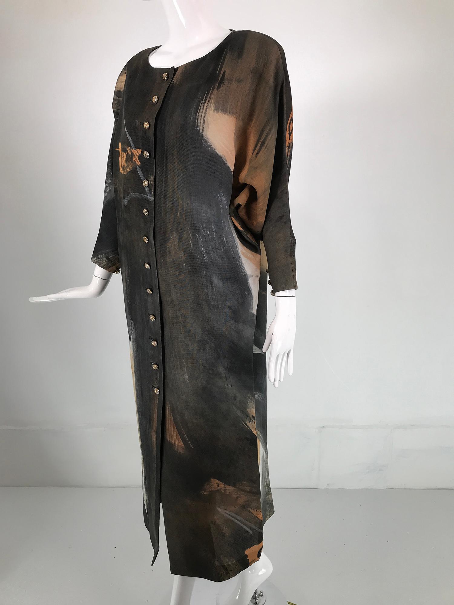 Christian Lacroix painted silk button front, bat wing dress from the 1980s. Textured silk with a modern painted design, this is a very unusual dress & not typical of Lacroix. Oval open neckline with bat wing sleeves, large shoulder pads, the sleeves