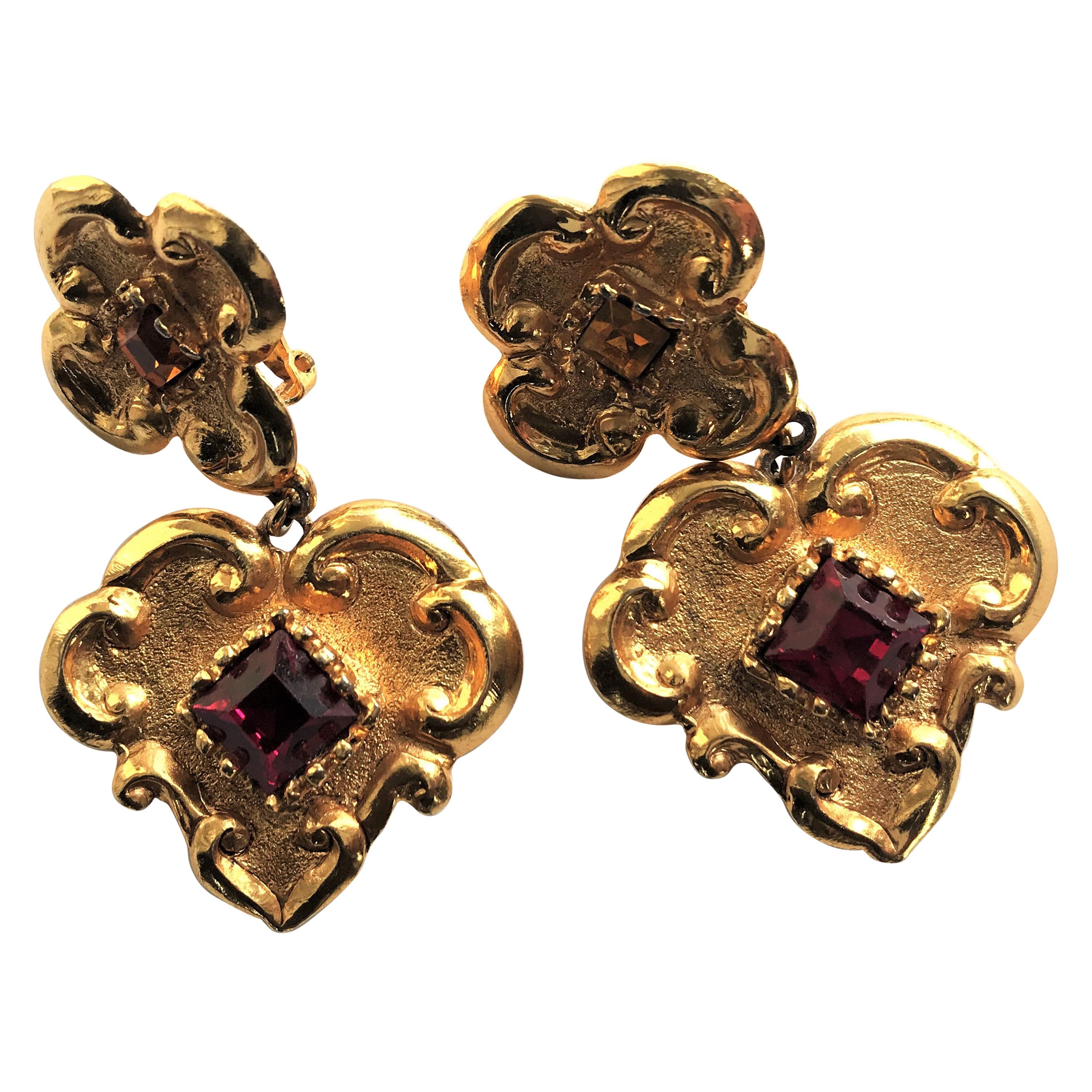 Artist Christian Lacroix Paris ear clips in the shape of a heart with red rhinestones 