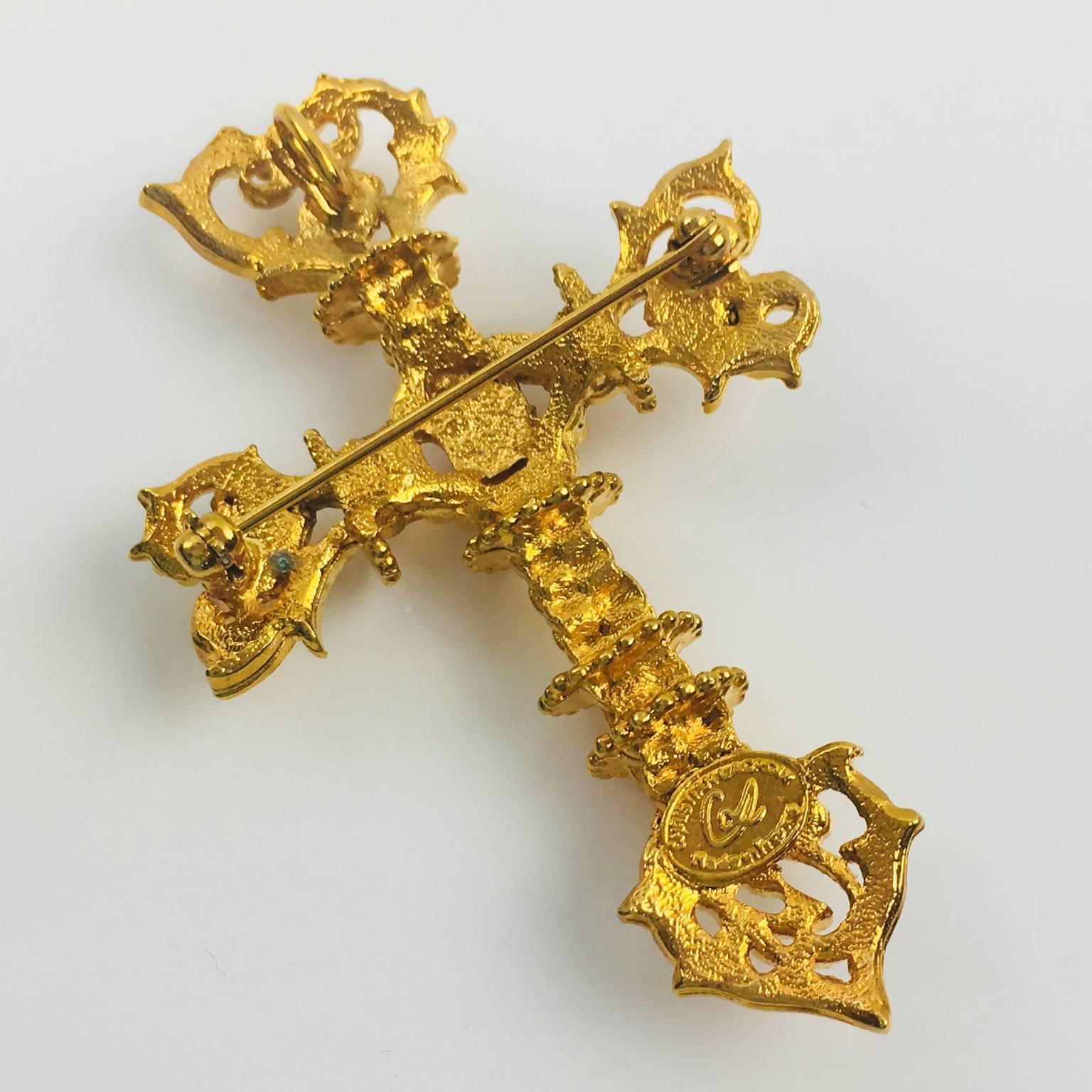 Stunning Christian Lacroix Paris signed Pin Brooch. Lovely gilt metal extremely textured, pierced and see thru shape featuring a large baroque cross. Signed at the back 