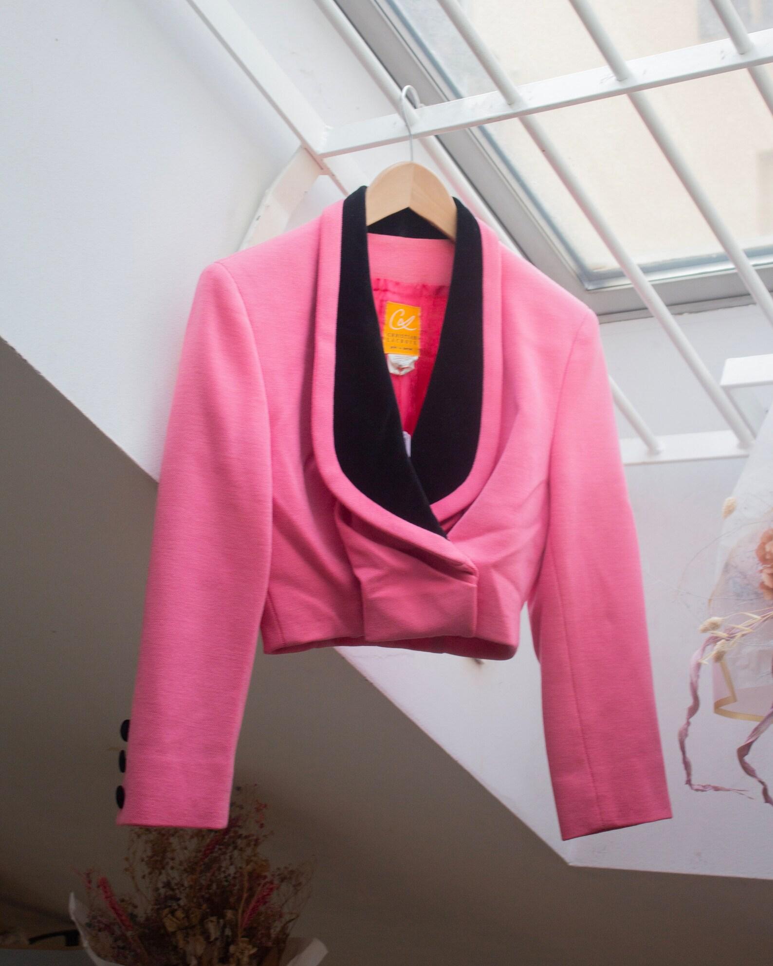 Christian Lacroix Prêt-a-porter early 90's shocking pink wool cropped bolero jacket with gathered front and oversize black velvet lapel (S)
Buttons closure (inside) and three velvet buttons on each cuff
Fully lined in cupro
100% wool 
Made in Italy