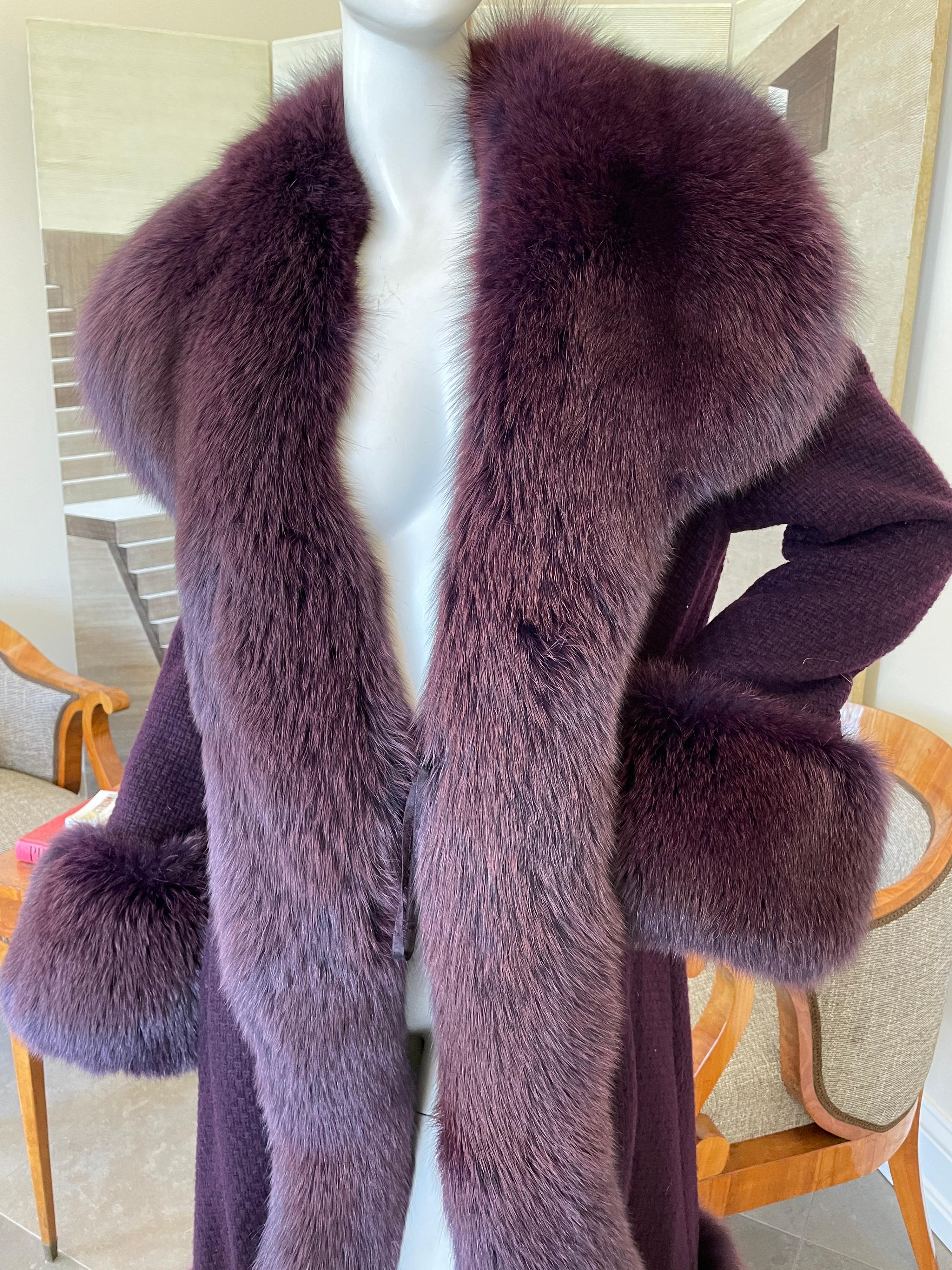 Christian Lacroix Purple Pure Cashmere Coat with Fox Trim.
So beautiful, lined cashmere coat with luxurious fox fur trim from Christian Lacroix.
Size 42 with a generous cut, runs large.
Bust 44