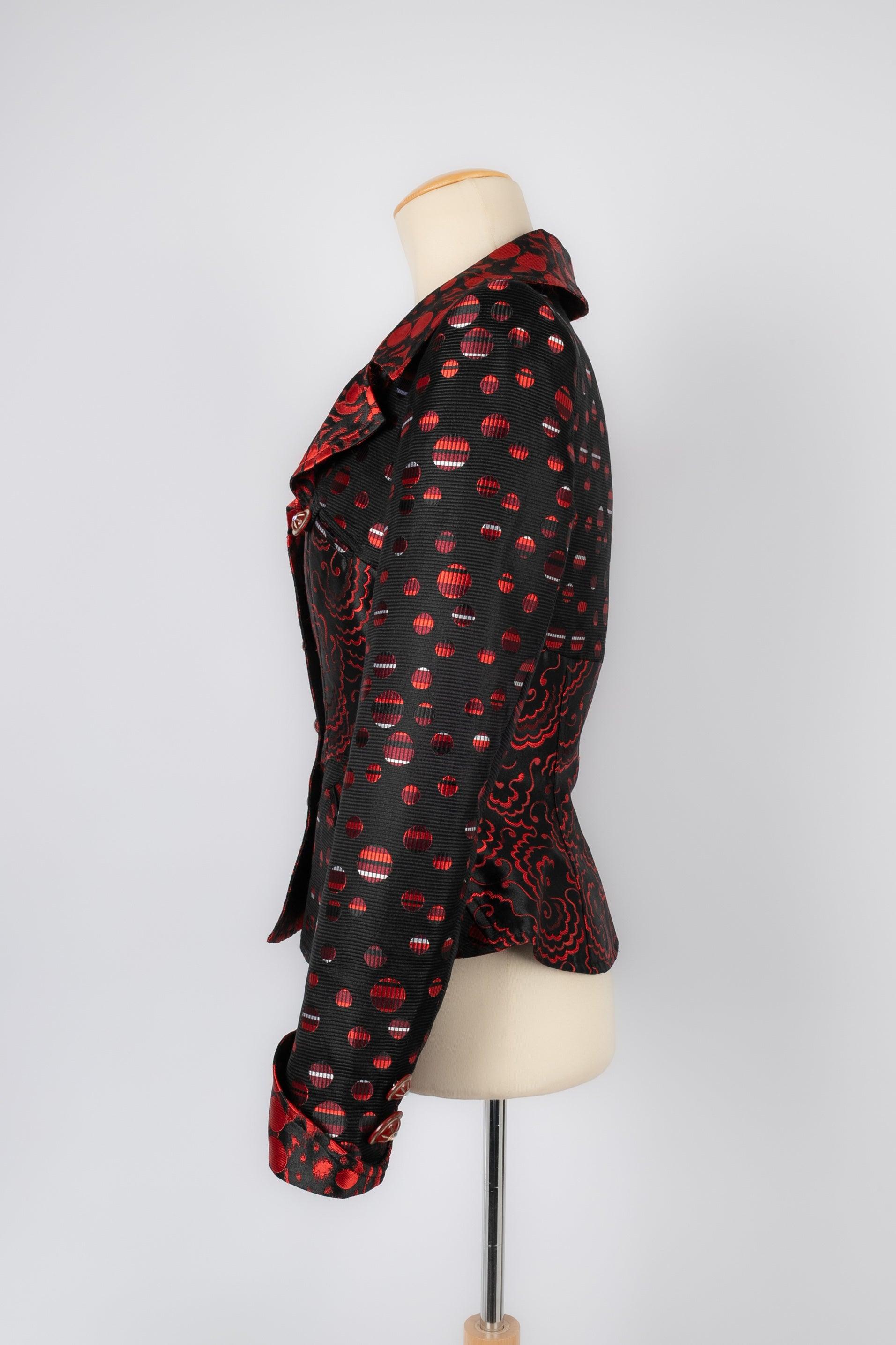 Christian Lacroix - (Made in France) Black and red tones jacket. Silk lining. No size nor composition label, it fits a 36FR/38FR. To be mentioned, very slitght ring stains on the silk lining.

Additional information:
Condition: Good