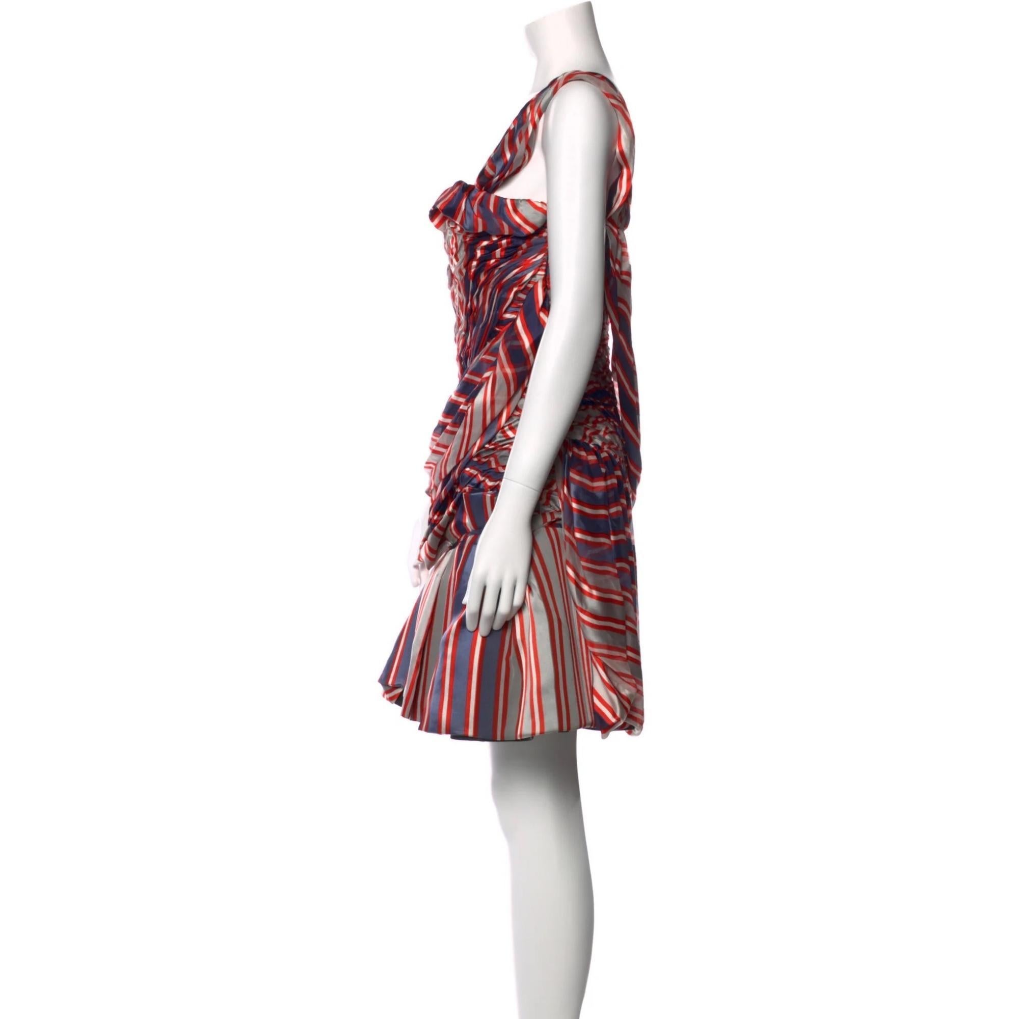 Christian Lacroix Silk A-Line Dress. Red. Printed. Pleated & Ruffle Accents. Sleeveless with One-Shoulder. Concealed Zip Closure at Sider

COLOR: Red
MATERIAL: 100% Silk; Lining 100% Silk; Combo 71% Silk, 29% Cotton

SIZE: M  US8,
