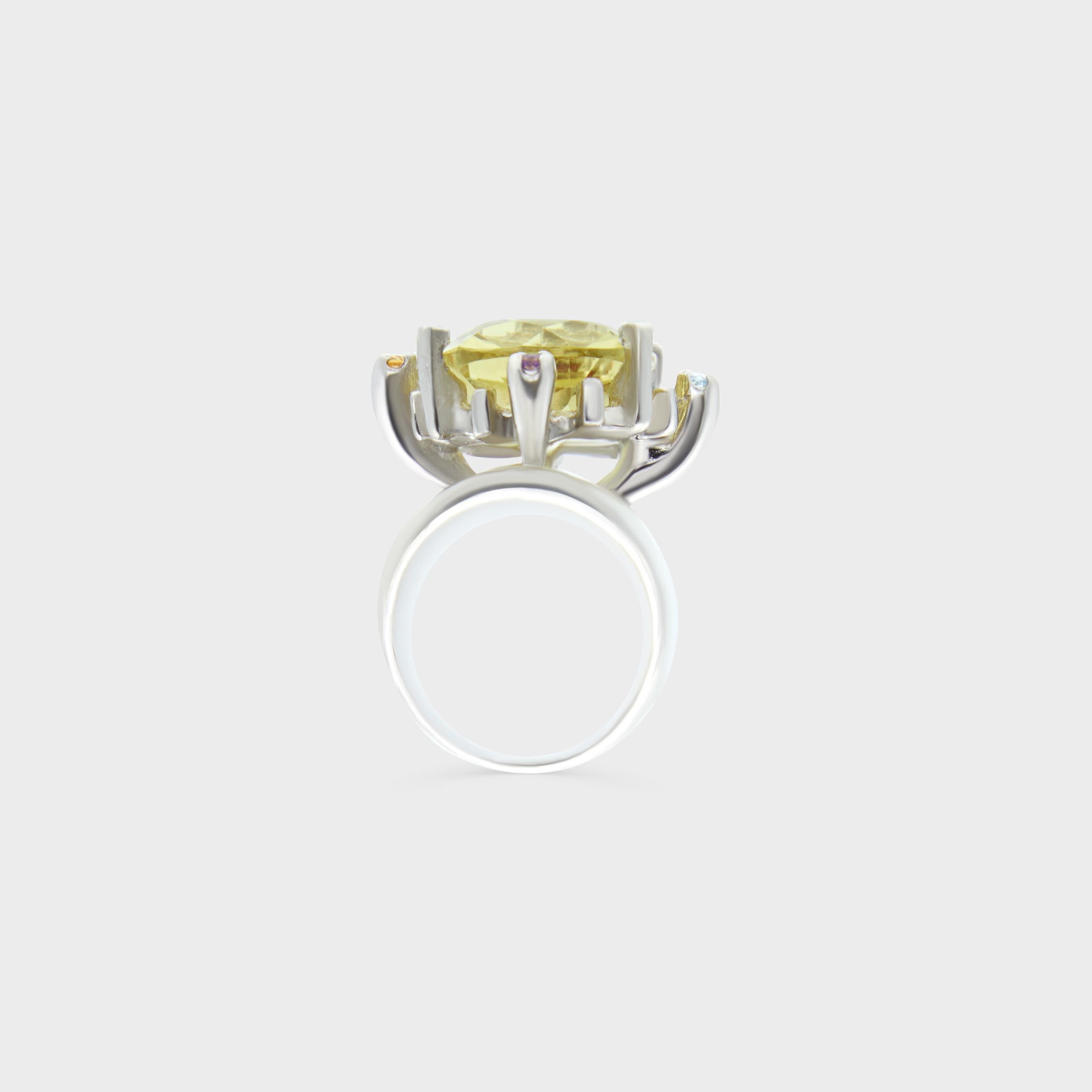 An exceptional sculptural ring from Christian Lacroix, circa 1990, showcasing the designer’s signature mix of fantasy and craftsmanship. Cast in 925 sterling silver, the piece is centered with a cushion-cut pale yellow citrine held in a dramatic