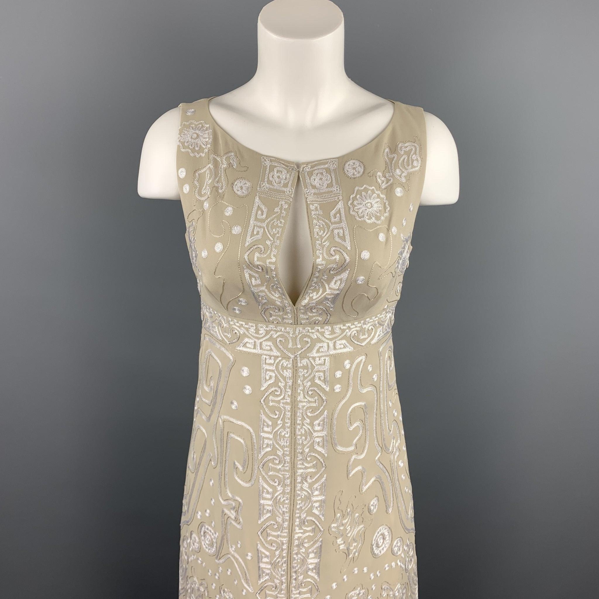 CHRISTIAN LACROIX cocktail dress comes in a beige silk featuring a shift style, embroidered details, and a side zipper closure.
Very Good
Pre-Owned Condition. 

Marked:  36 

Measurements: 
 
Shoulder: 13 inches 
Bust: 30 inches 
Waist: 28 inches