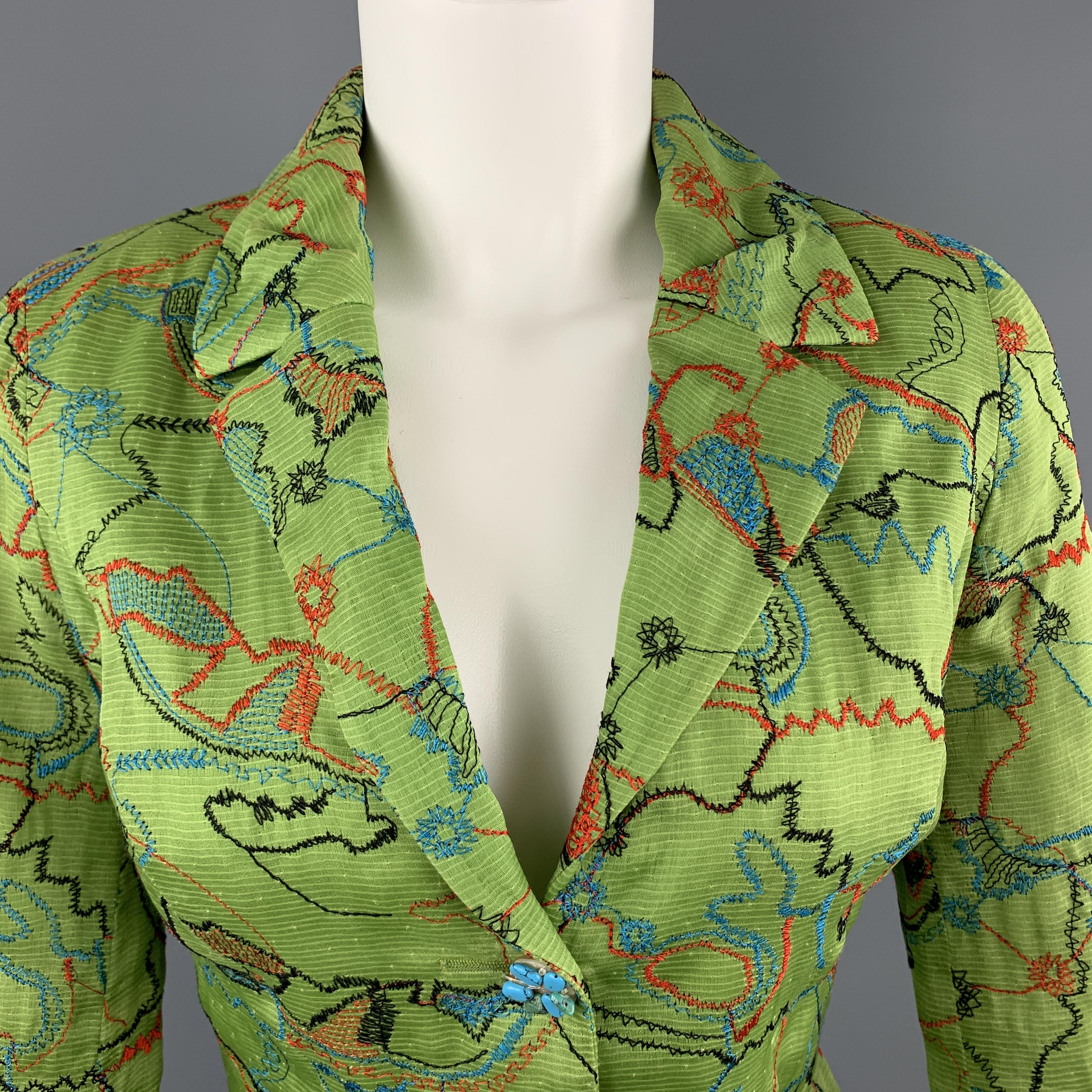 Vintage CHRISTIAN LACROIX blazer comes in muted lime green silk blend fabric with blue and red embroidery pattern throughout, tailored waist, pleated lapel, and single breasted button front with faux turquoise and rhinestone embellished buttons.