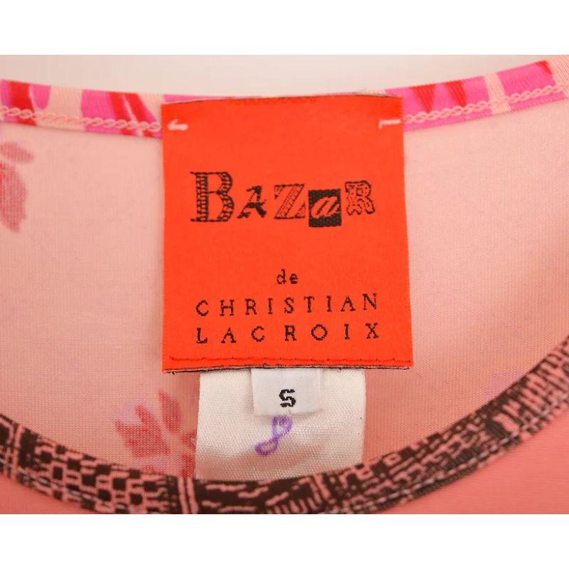 Cute Vintage Christian LaCroix Spring / Summer 1998 Tank top, in a Stunning pink printed pattern on both front and reverse. 

Features:
Rounded neckline
Hip length hem
Slogan / Logo detail front

90% Rayon / 10% Spandex

Sizing: Pit to Pit: 15'' -