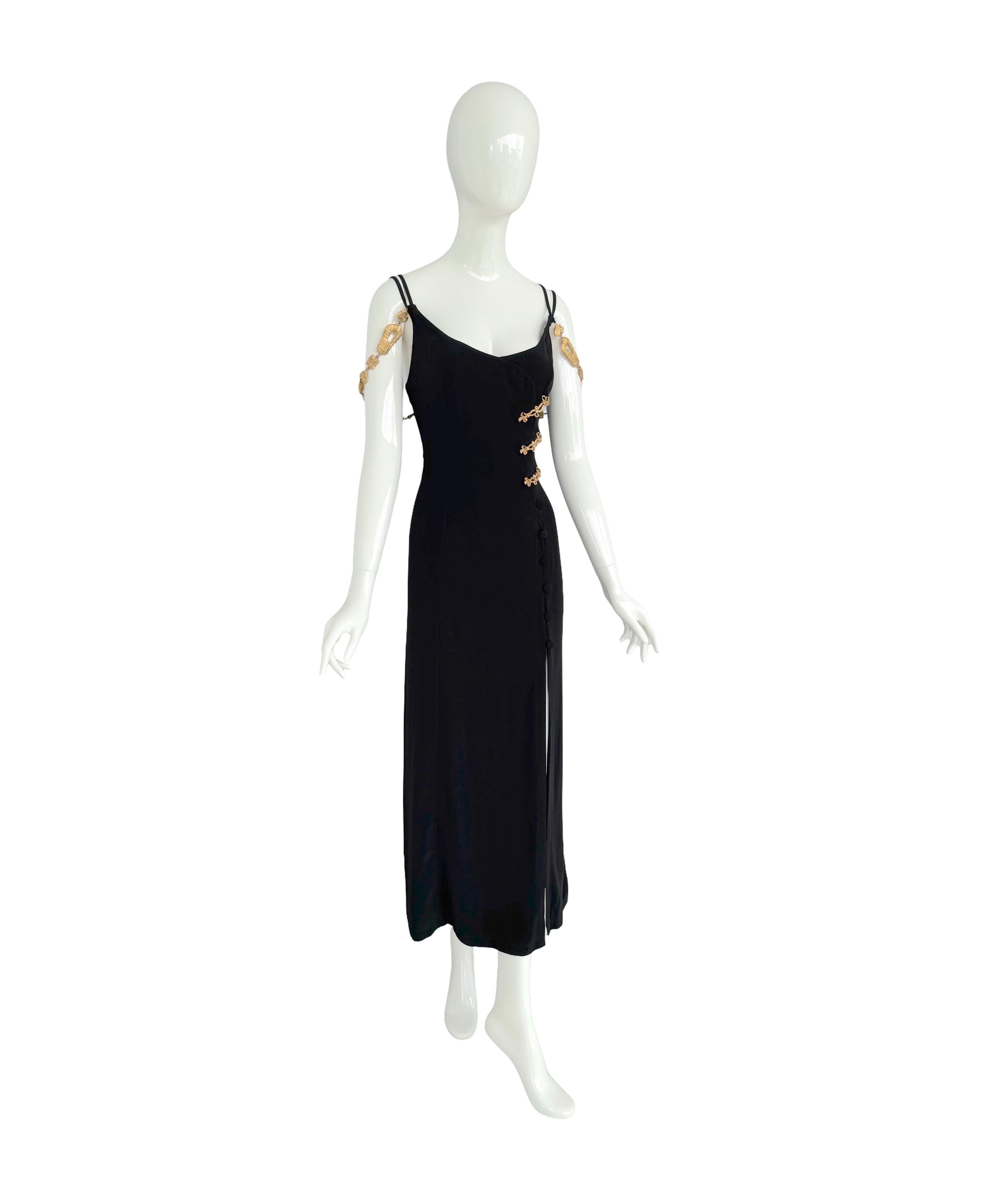 Christian Lacroix Vintage Spring/Summer 1994 Rare Black Dress Embellished With Gold Signed Jewelry Details

This striking black viscose dress from Christian Lacroix's iconic Spring/Summer 1994 collection features a beautiful structured front
