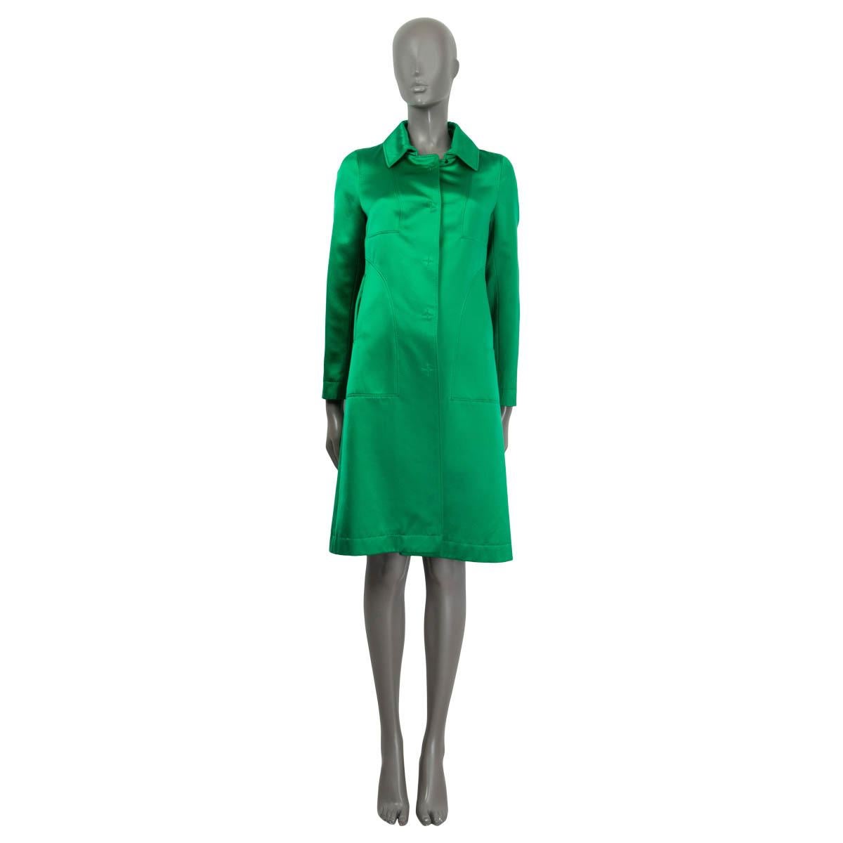 100% authentic Christian LaCroix satin coat in green cotton (68%) and silk (32%). Features two slit pockets on the front and long sleeves. Opens with five push buttons on the front and a button at the neck. Lined in green silk (100%). Shows some