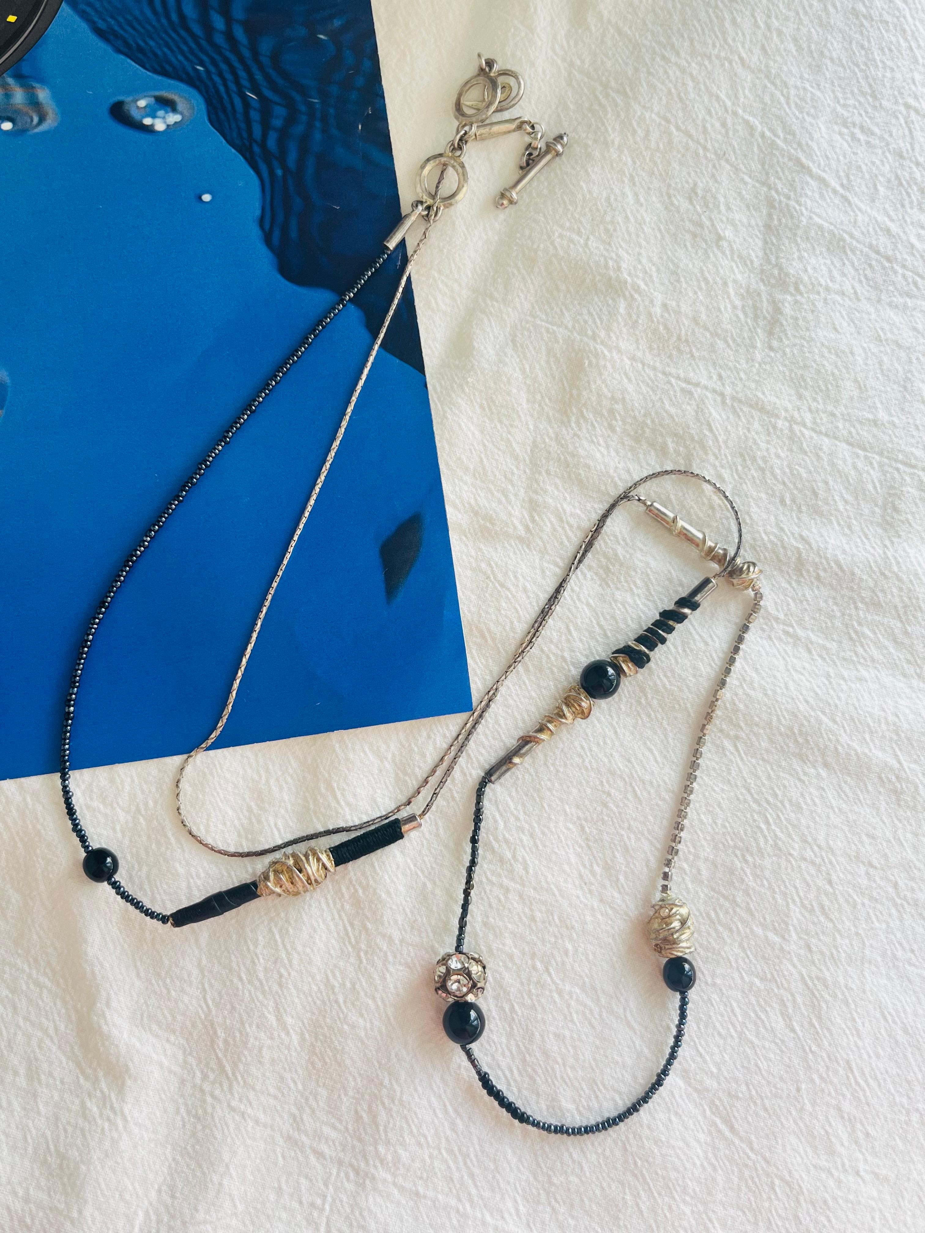 Christian Lacroix Vintage 1980s Unisex Asymmetric Black Crystals Ball Bar Modernist Abstract Long Necklace, Silver Plated

Versatile necklace. Can be worn as 1/2/3/4 layers.

Good condition. Some light scratches, colour loss. 100% genuine. Rare to