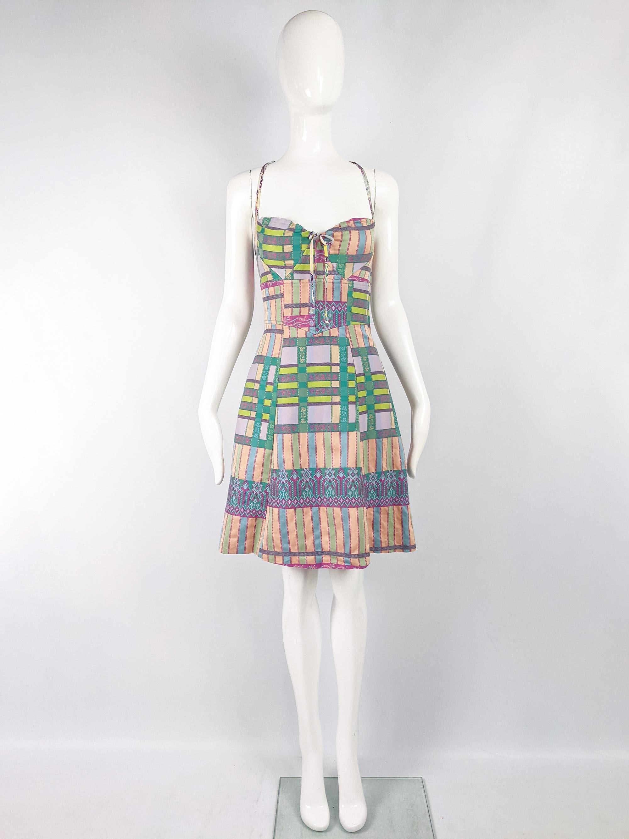 A fabulous vintage Christian Lacroix dress from the 90s. In a patterned patchwork of fabrics featuring checks, stripes and floral jacquard. It has a sexy sweetheart neckline with a double spaghetti strap detail and racer back. Perfect for a party or