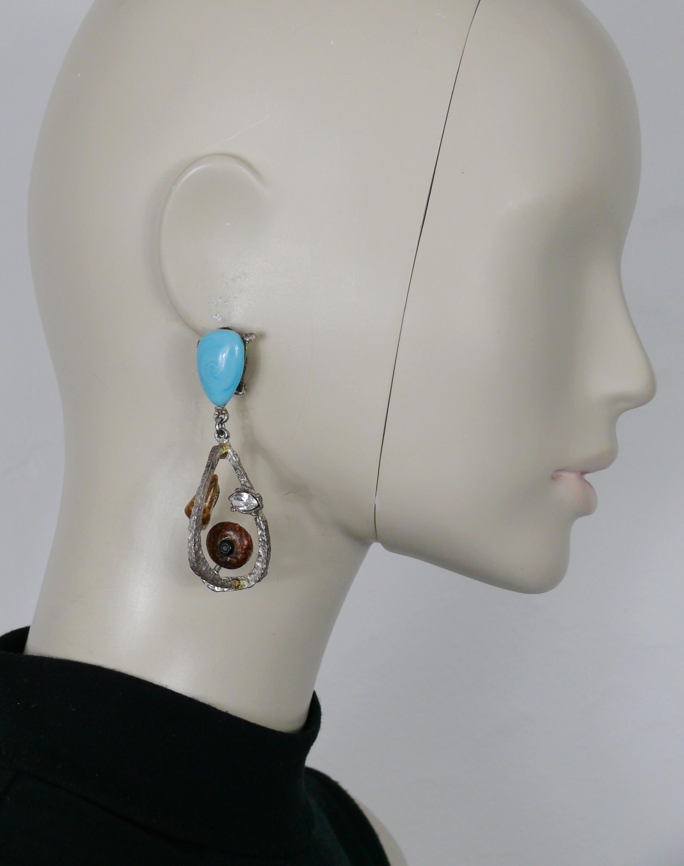 CHRISTIAN LACROIX vintage 3-dimensional silver tone abstract design dangling earrings (clip-on) embellished with blue glass cabochon, clear crystal and enamel.

Marked CHRISTIAN LACROIX CL Made in France.

Indicative measurements : height approx.