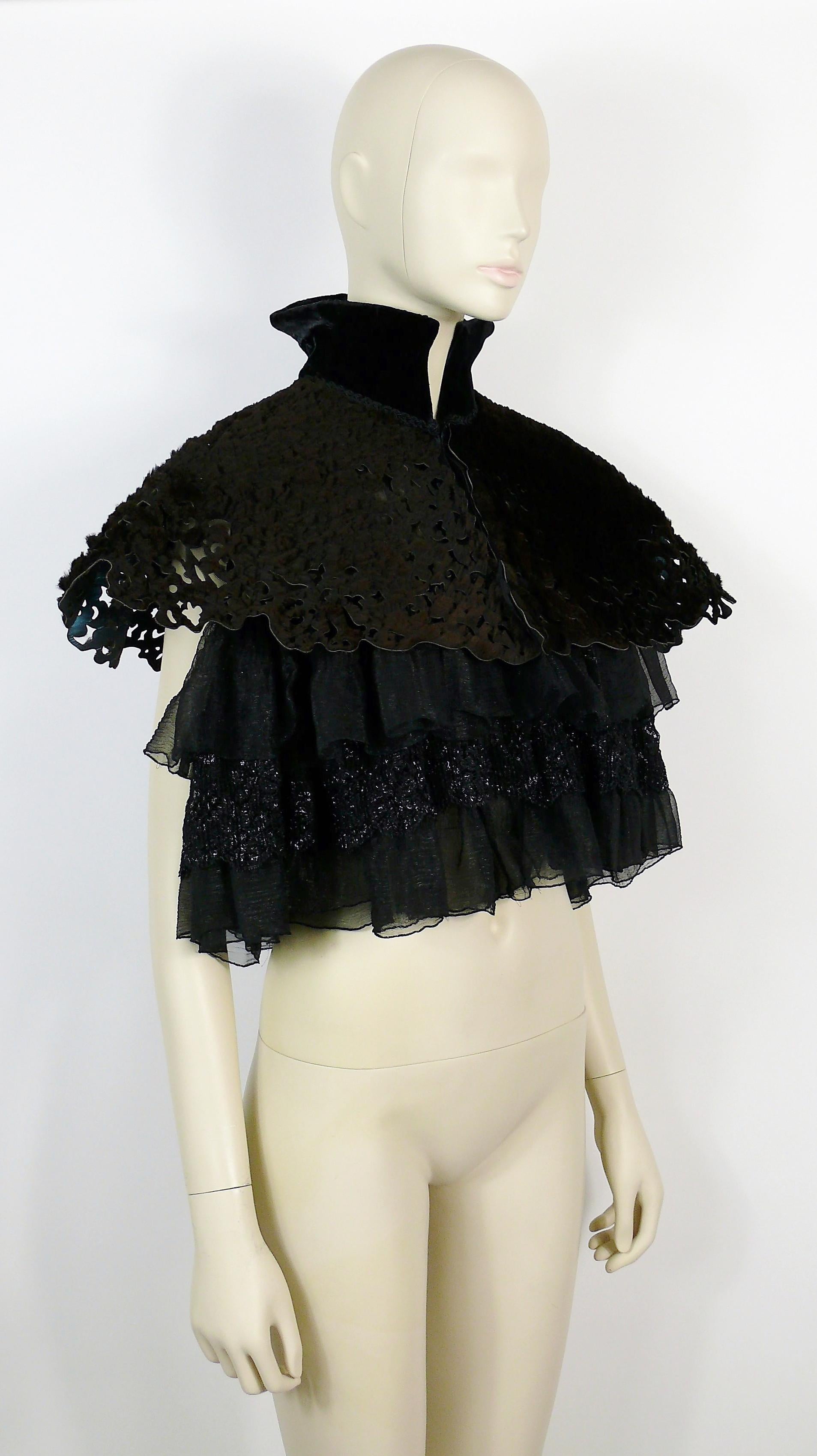 CHRISTIAN LACROIX vintage rare cape short cloack.

This cape features :
- Laser cut farmed kangaroo brown fur.
- Structured black velvet collar.
- Lace and organza ruffles.
- Front hook closure.

Label reads CHRISTIAN LACROIX Paris.

Size tag reads