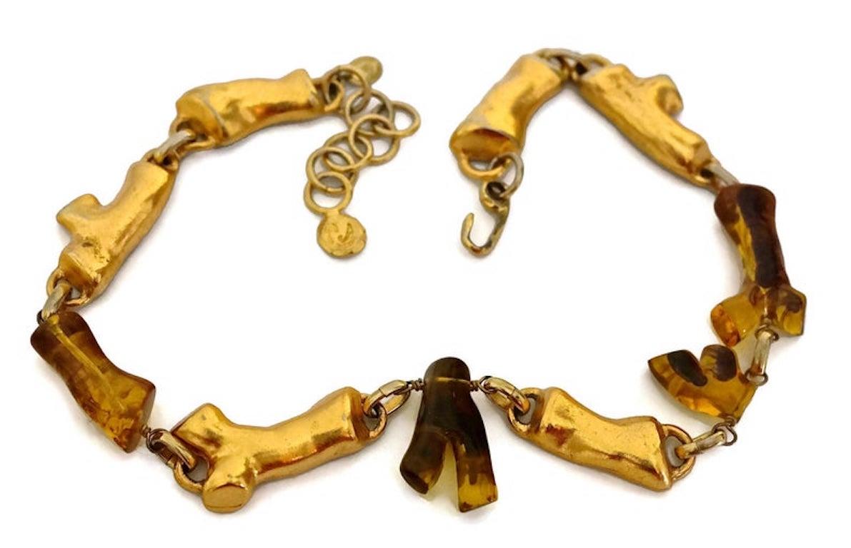 CHRISTIAN LACROIX Vintage Coral Gold Amber Lucite Necklace

Measurements:
Height: 1 3/8 inches (centre)
Wearable Length: 18 inches to 19 4/8 inches

Features:
- 100% Authentic CHRISTIAN LACROIX.
- Links of coral shapes in gold tone and lucite