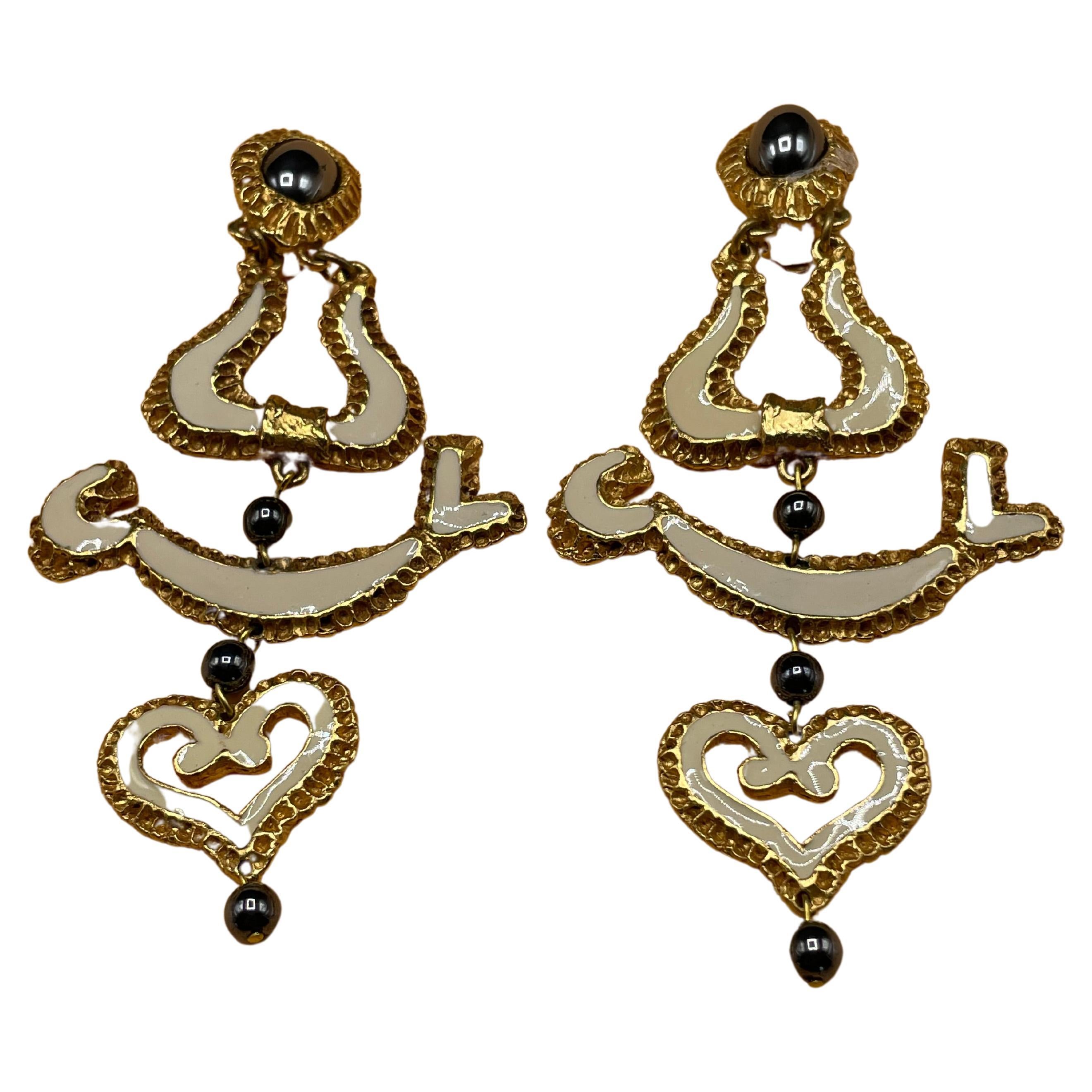 The heart-shaped pattern on the earrings, which Christian Lacroix frequently employed to create his jewelry, is a representation of his creative aesthetic.  Made in France. In perfect condition, and quality. With the Christian Lacroix stamp on the